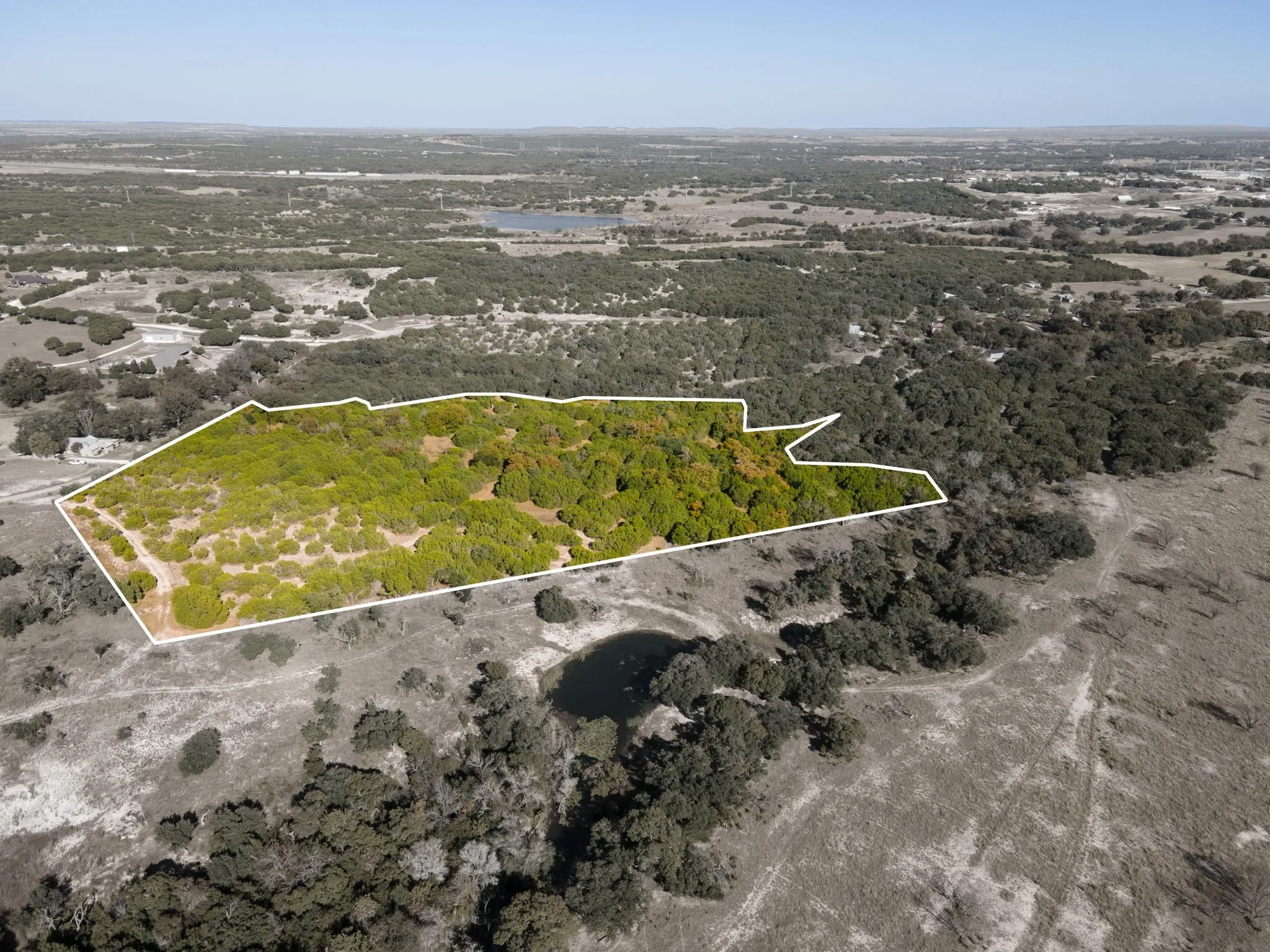 Aerial view of property's location featuring property parcel outlined