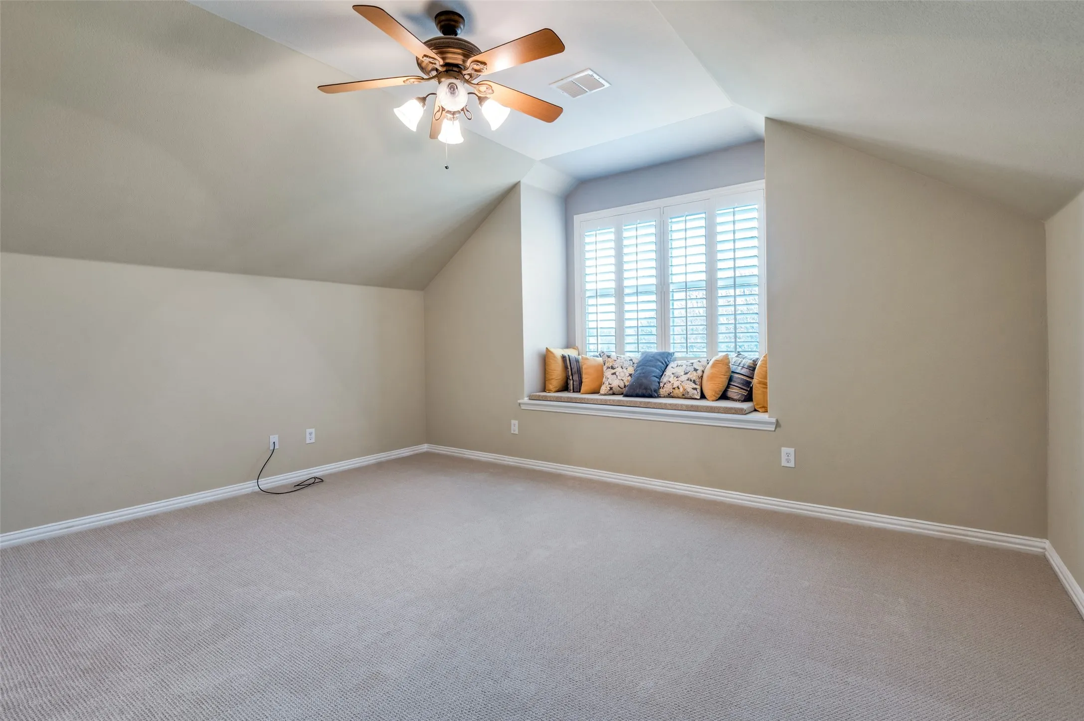 Bedroom or Bonus room featuring vaulted ceiling, carpet flooring, and ceiling fan