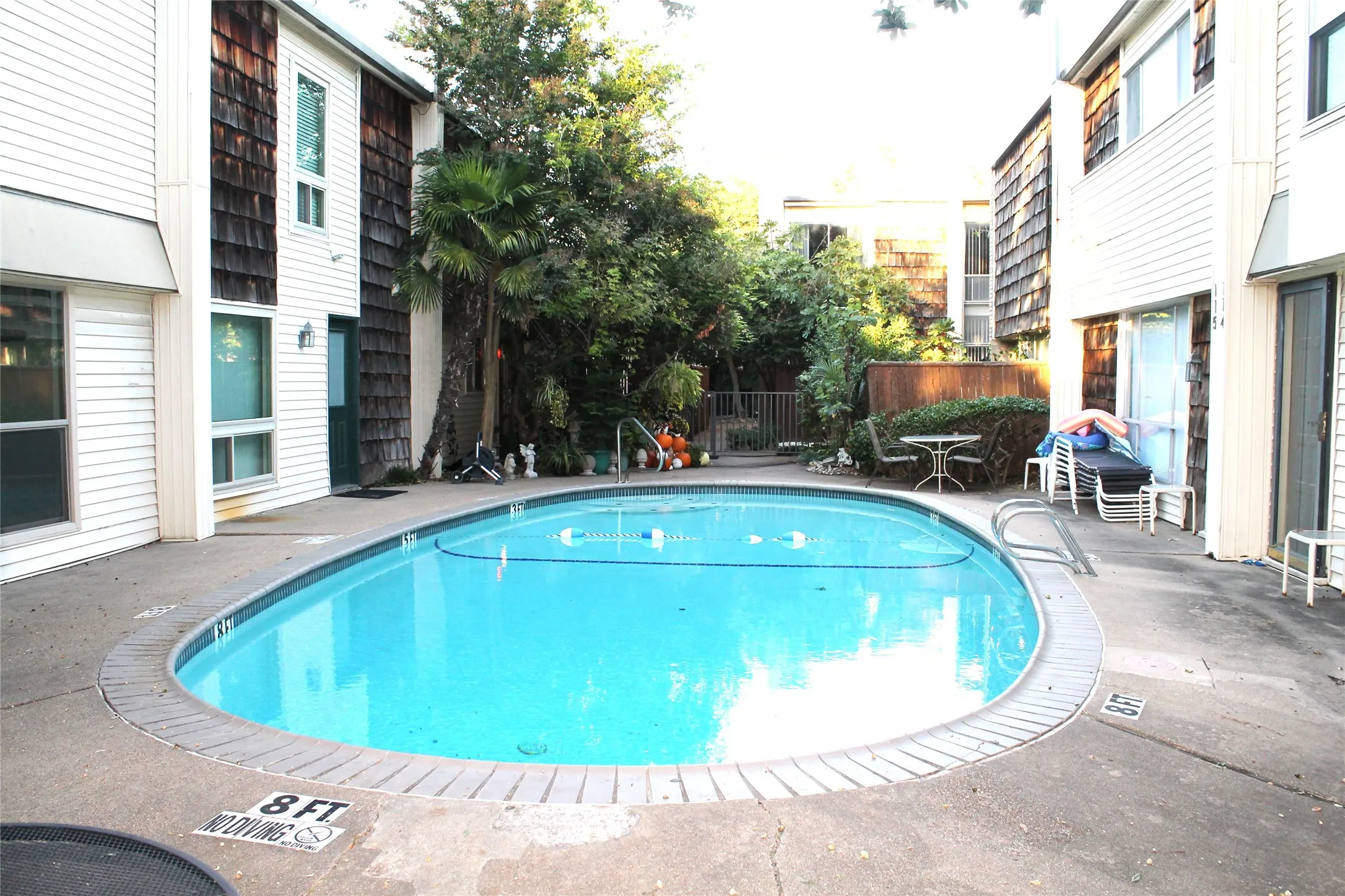 Community pool featuring a patio