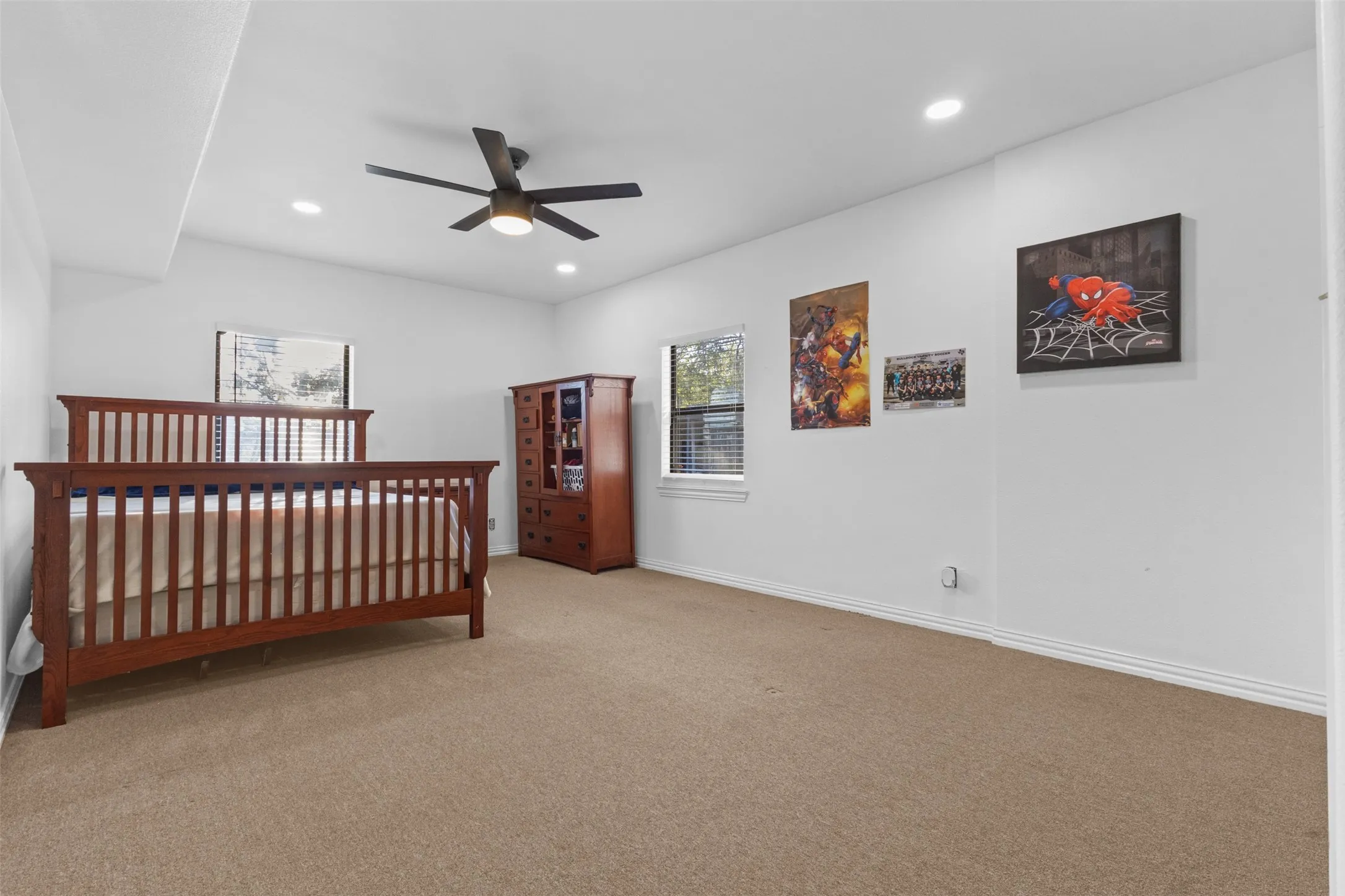 Bedroom with carpet floors, a ceiling fan, and recessed lighting