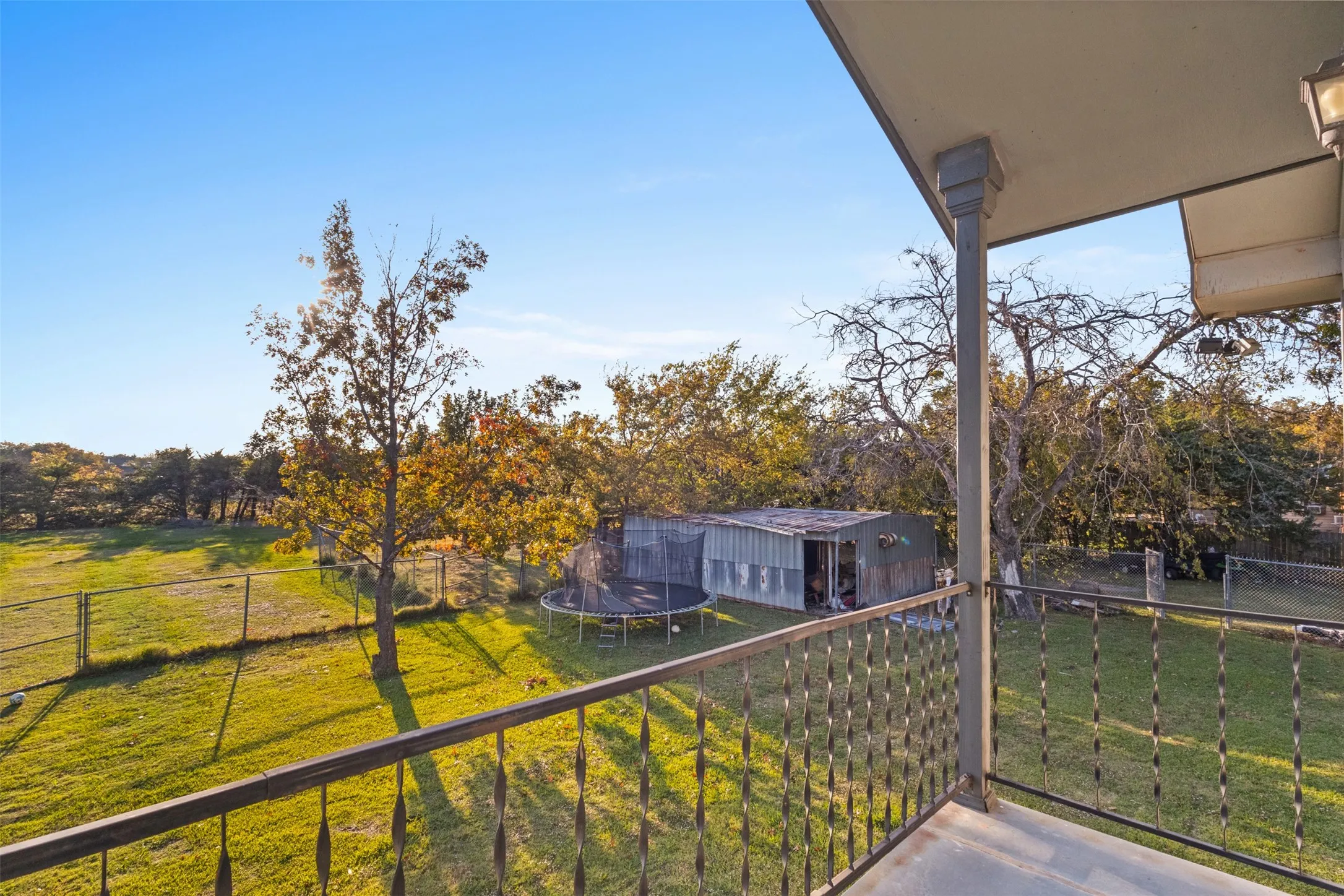 Balcony with view of wooded area