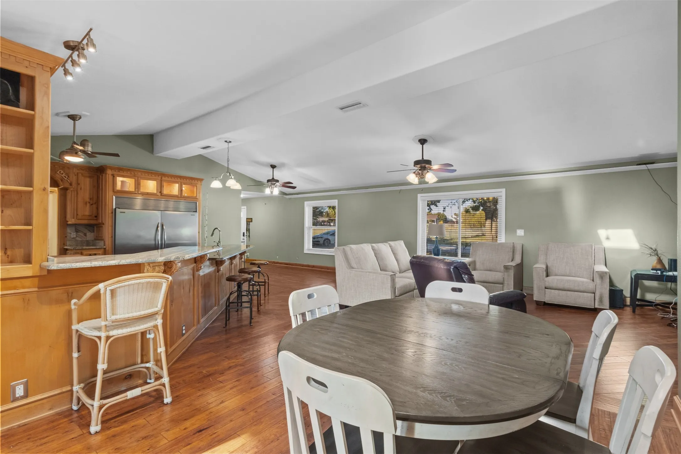 Dining room featuring wood finished floors and ceiling fan