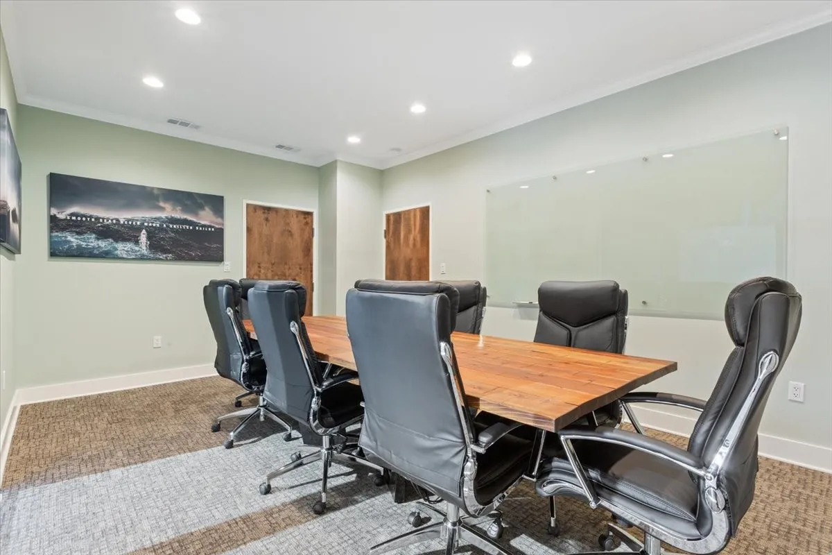Office with crown molding and recessed lighting