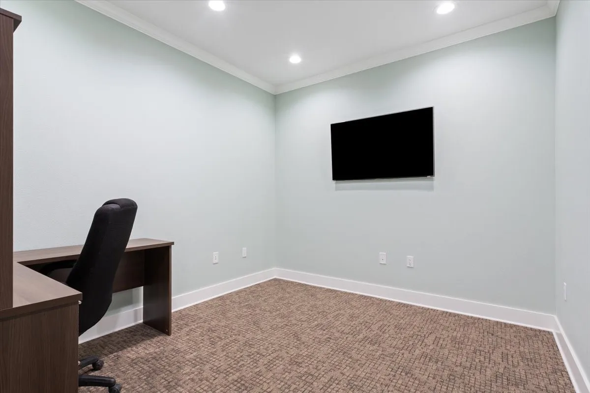 Unfurnished office with carpet flooring, ornamental molding, and recessed lighting