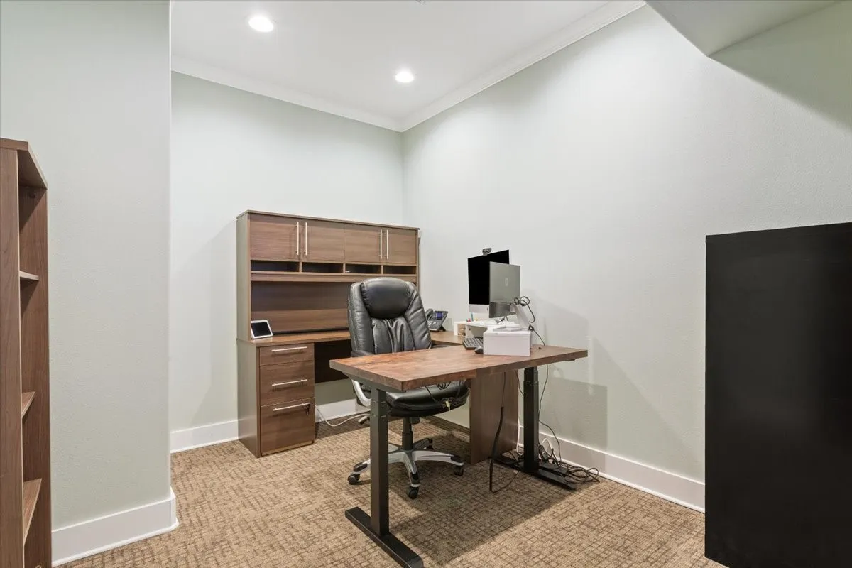Office area featuring crown molding, light colored carpet, and recessed lighting