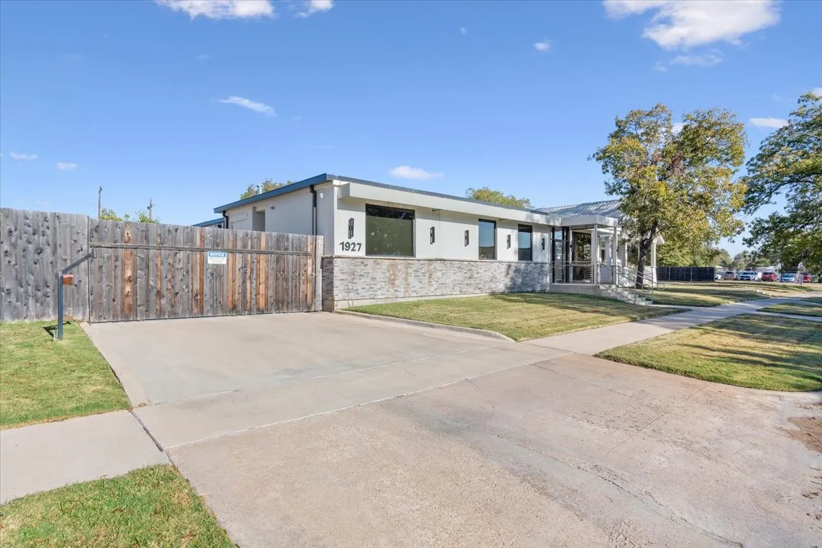 View of front of home with stone siding and stucco siding