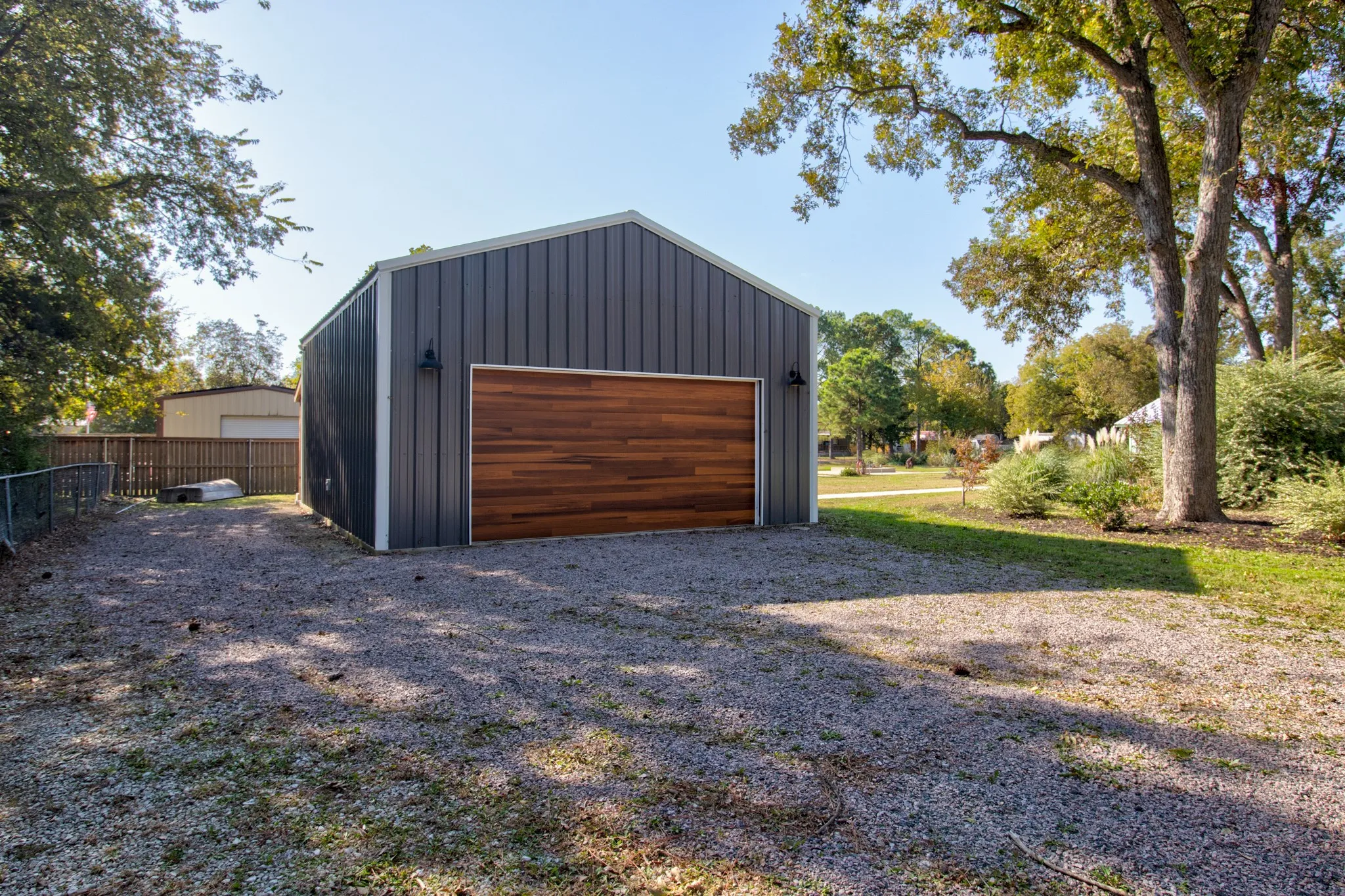 Two Custom wooden garage doors with high-end garage door openers on each!