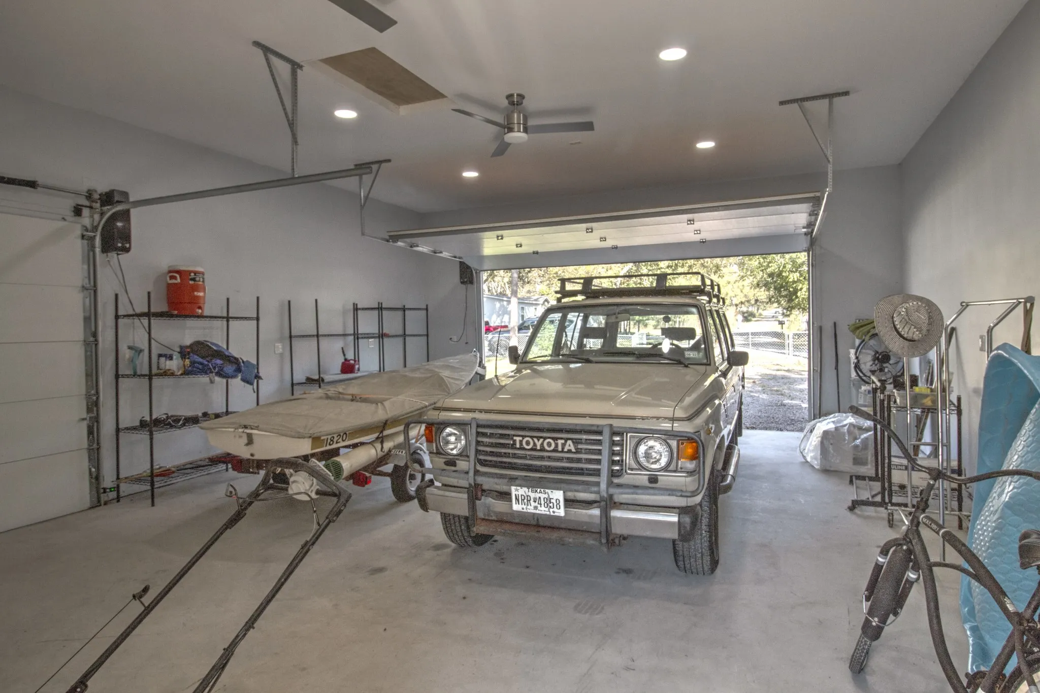 Completely Finished garage with Spray-On insulation, complete drywall, recessed lighting ceiling fans.