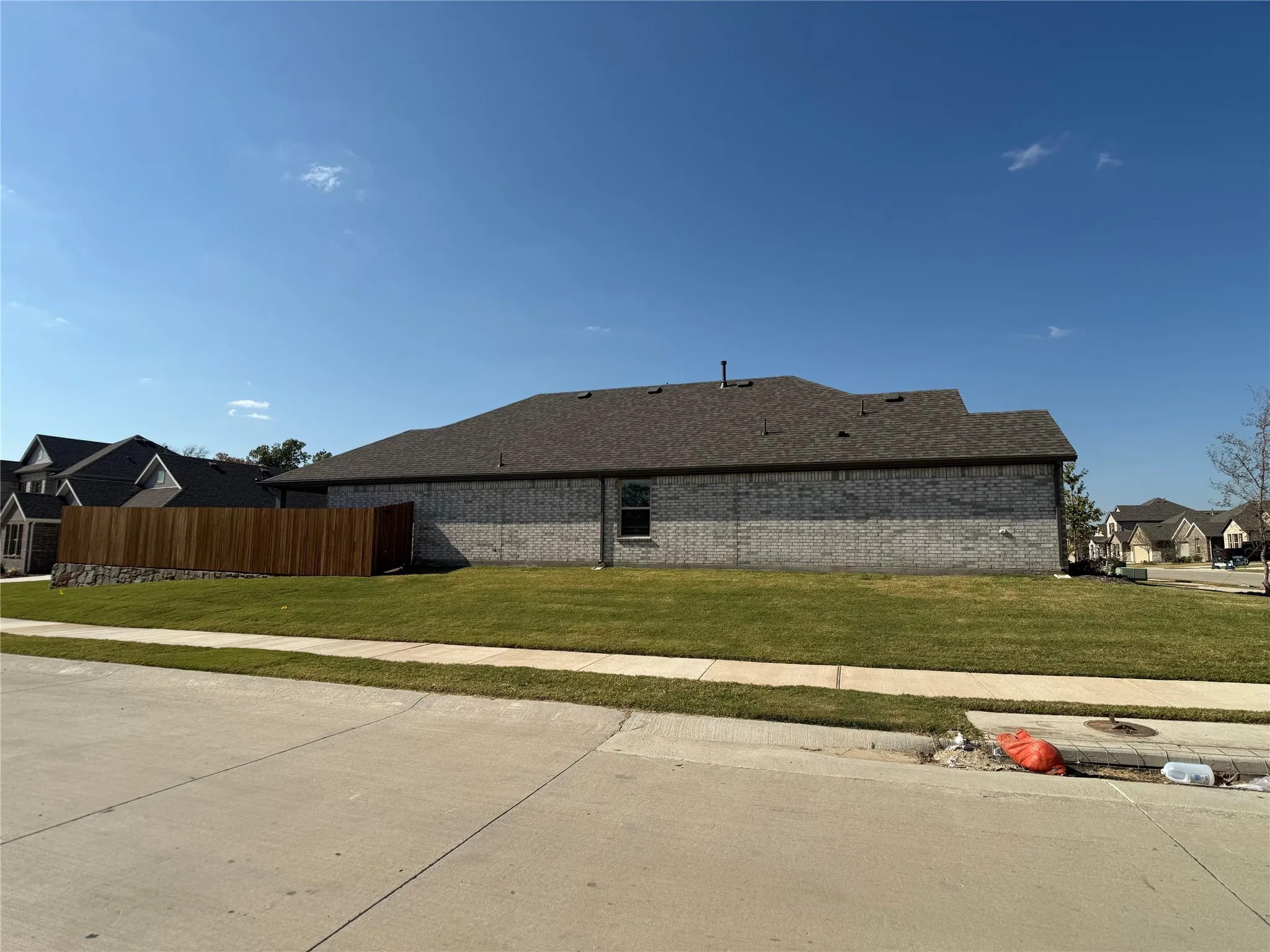 View of property exterior featuring brick siding