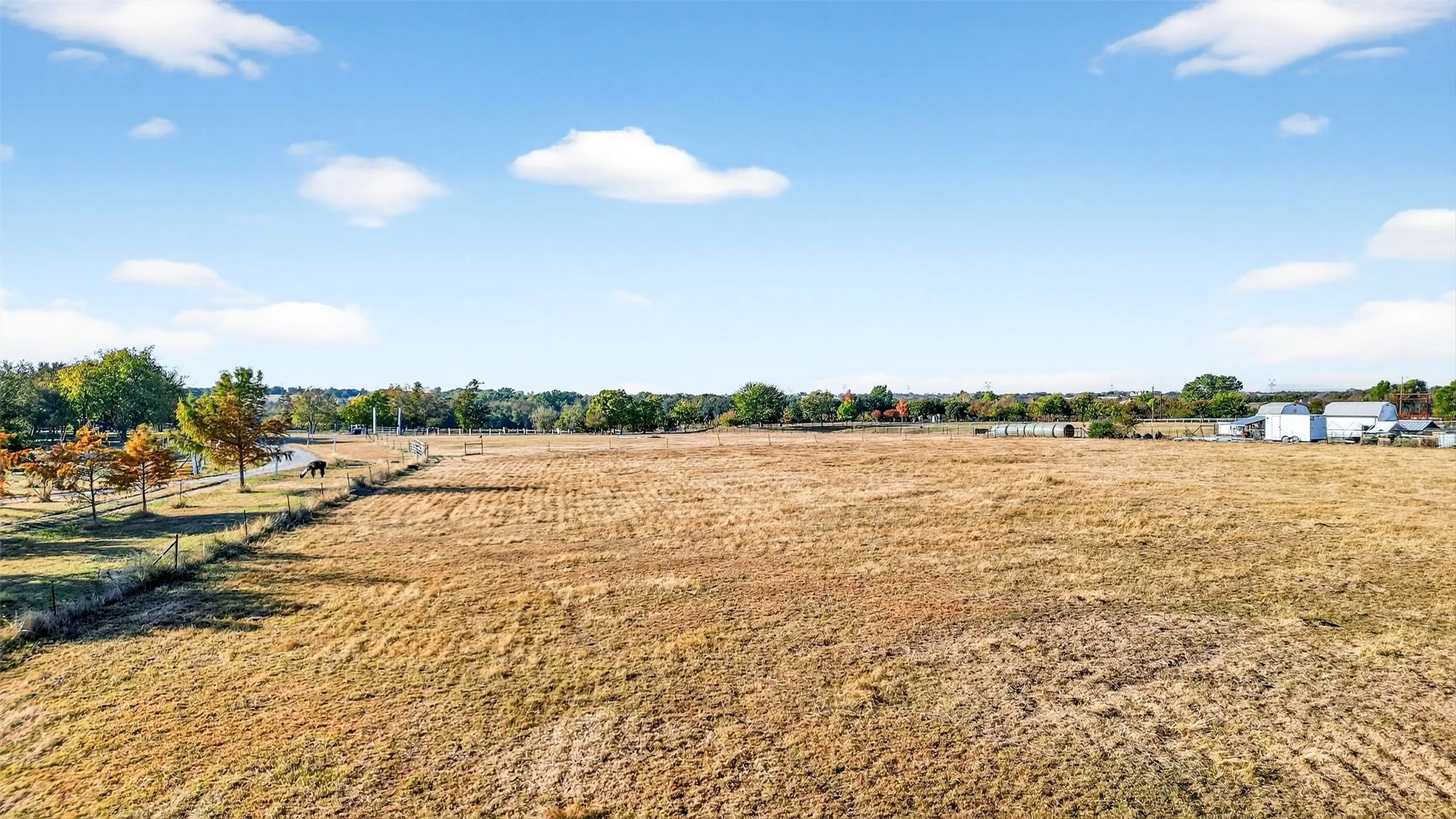 View of yard with a rural view