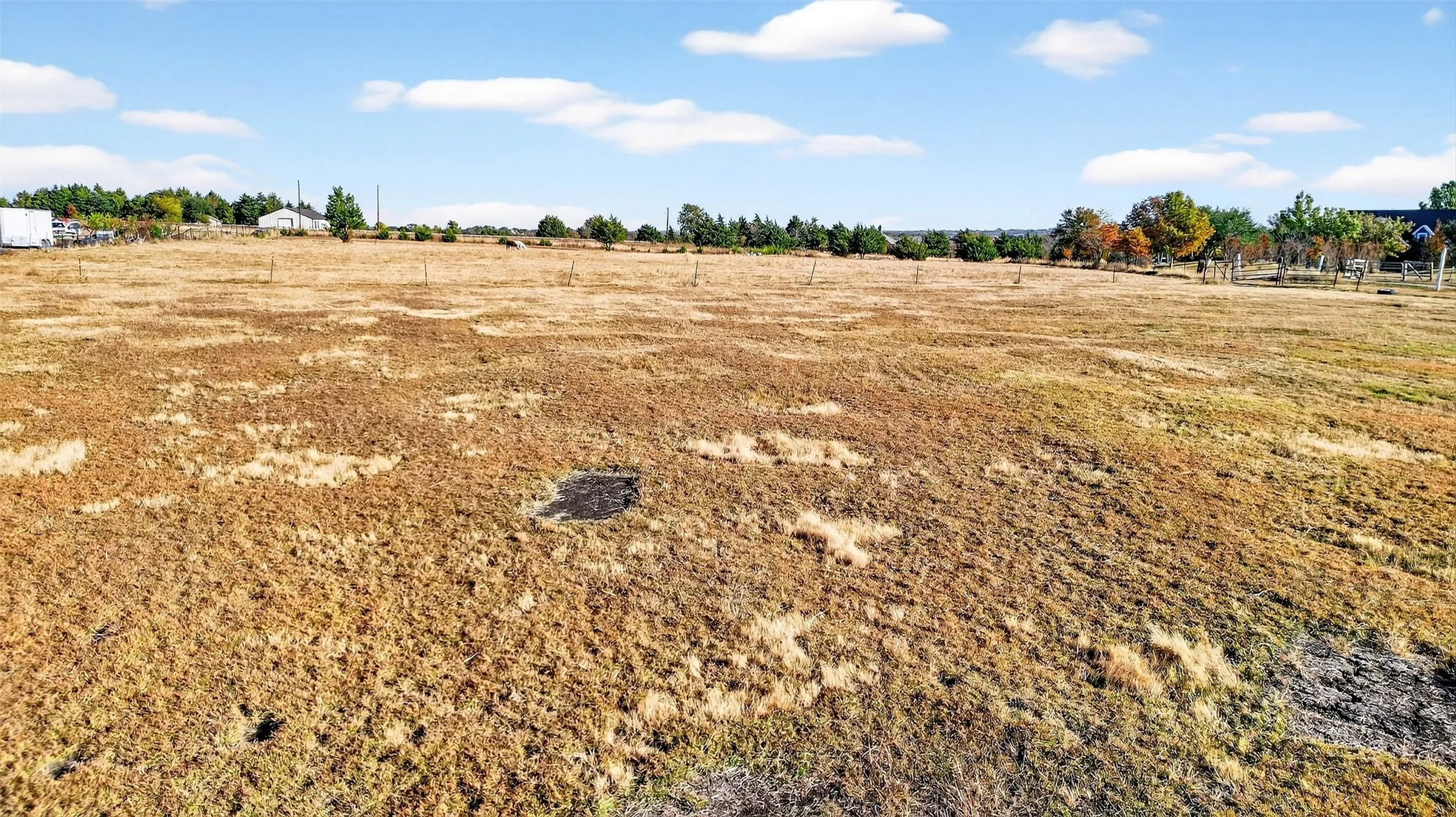 View of yard with a rural view