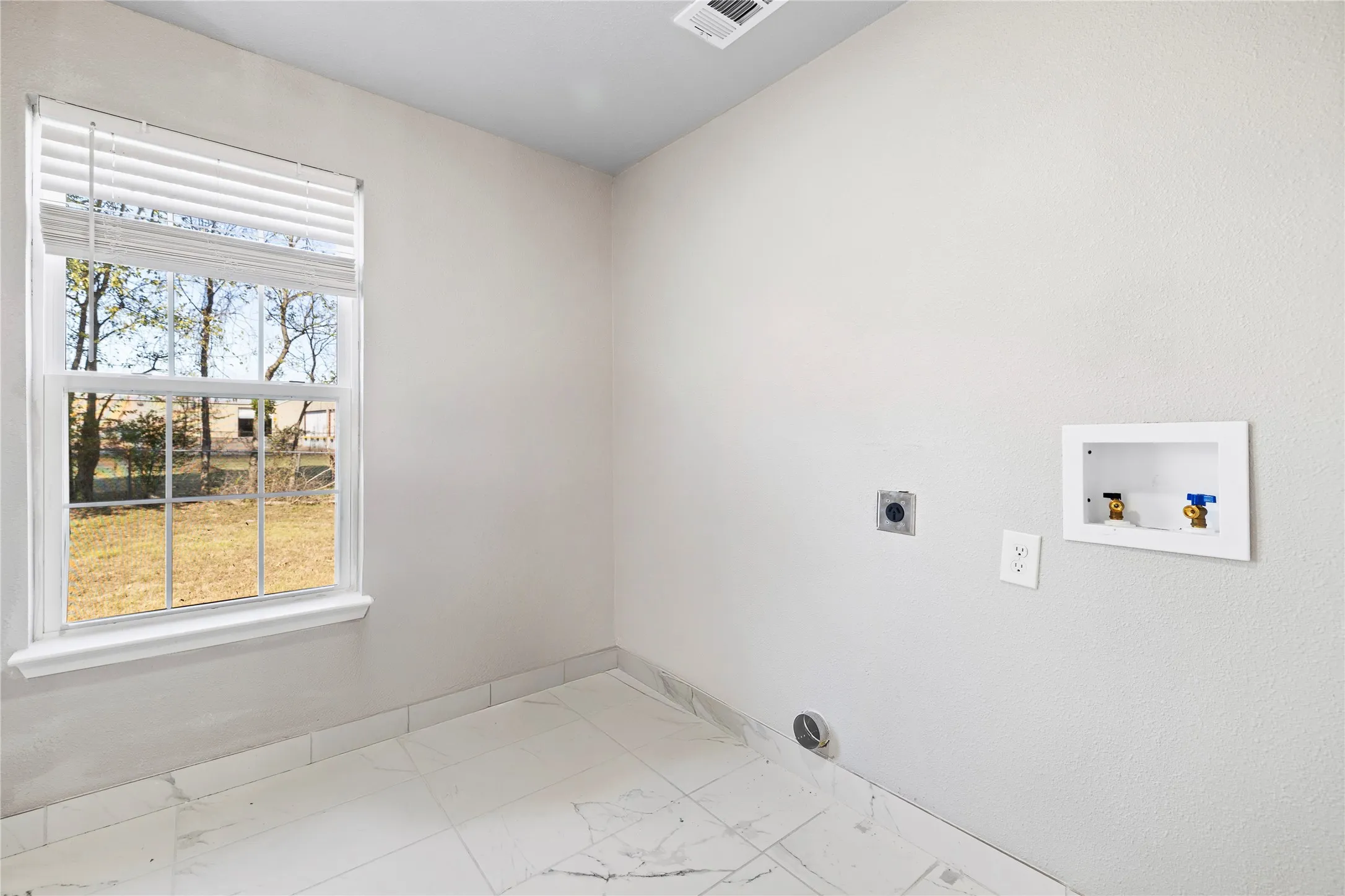 washer and electric dryer hookup in bathroom