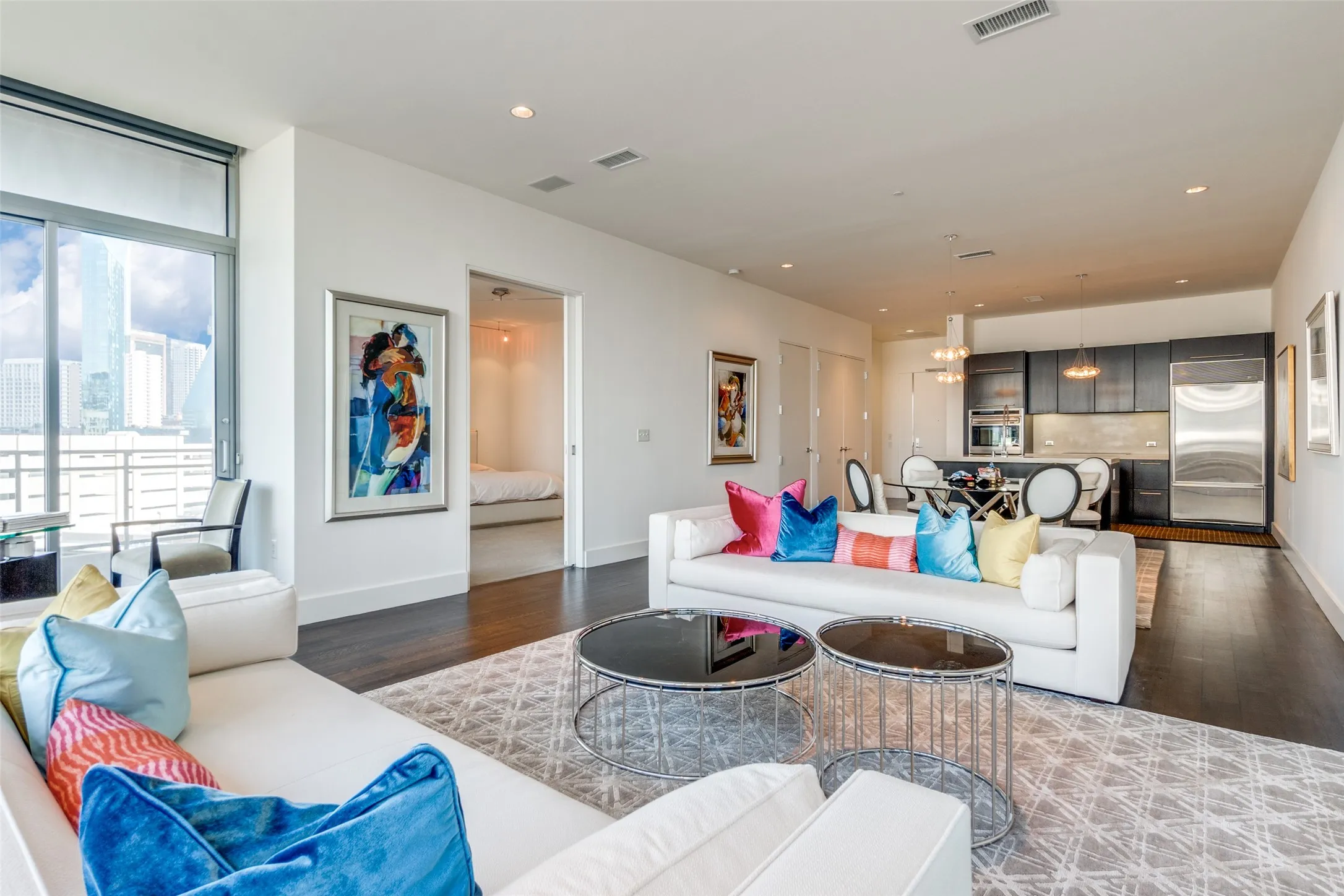 Living room featuring wood finished floors and recessed lighting