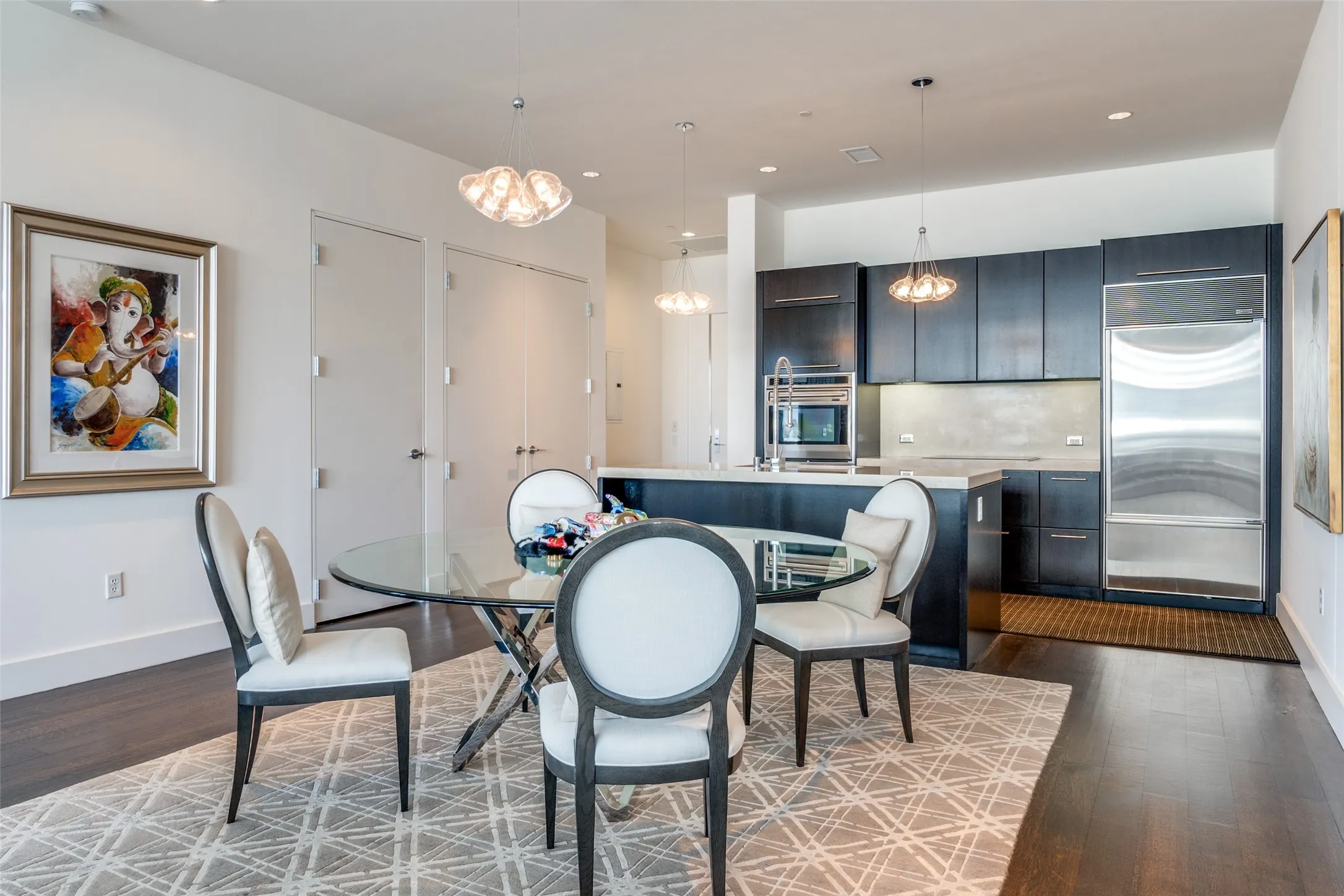 Dining room with recessed lighting, dark wood-type flooring, and a chandelier