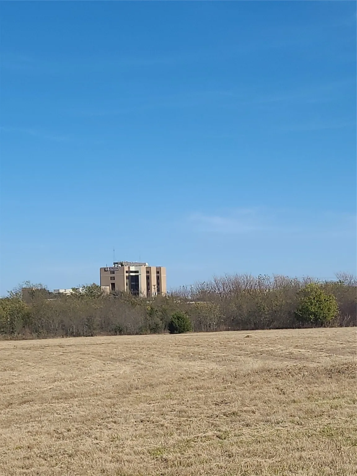 View of green lawn with a view of countryside