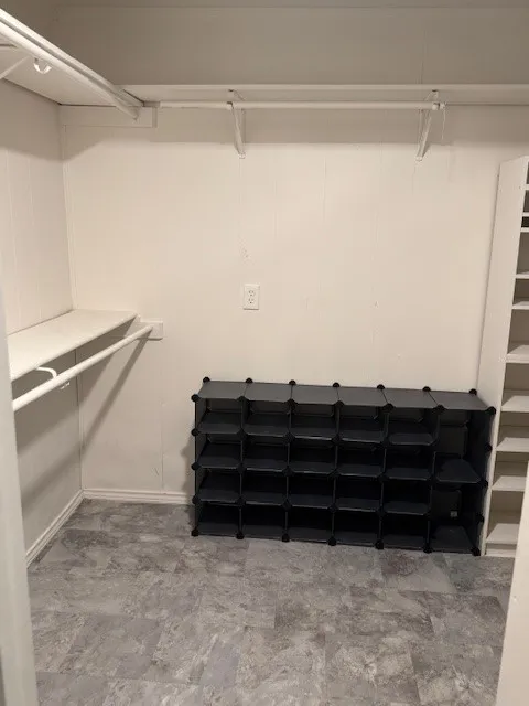 Spacious closet featuring light flooring
