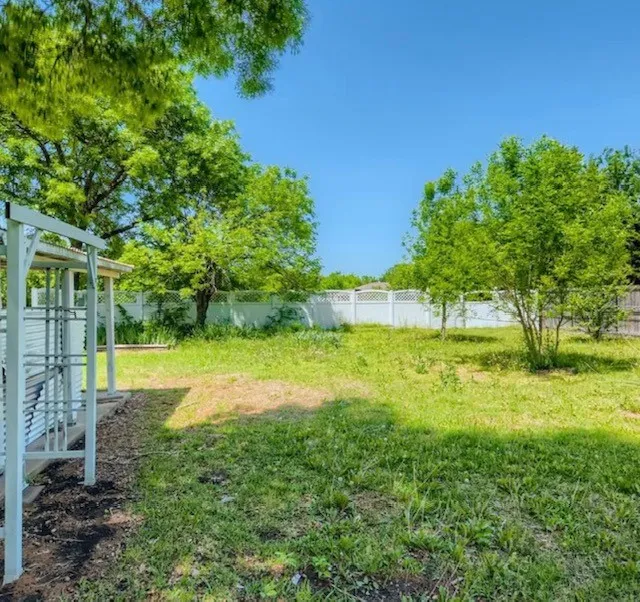 View of fenced backyard