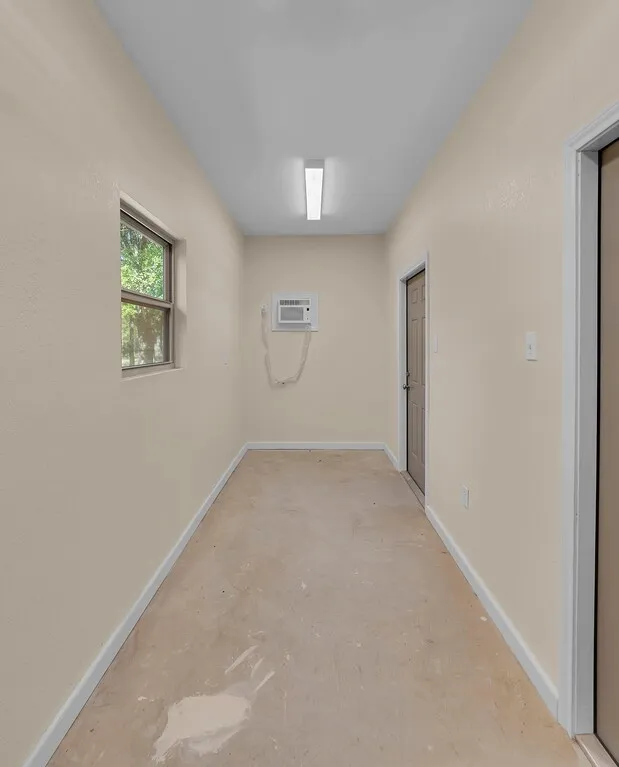 Enclosed storage inside carport.