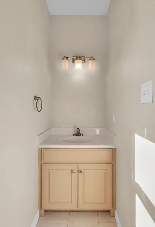 Bathroom with vanity and light tile patterned floors