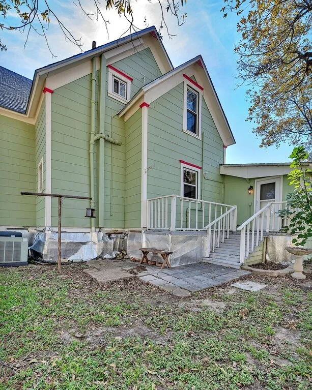 Rear view of property featuring a patio area