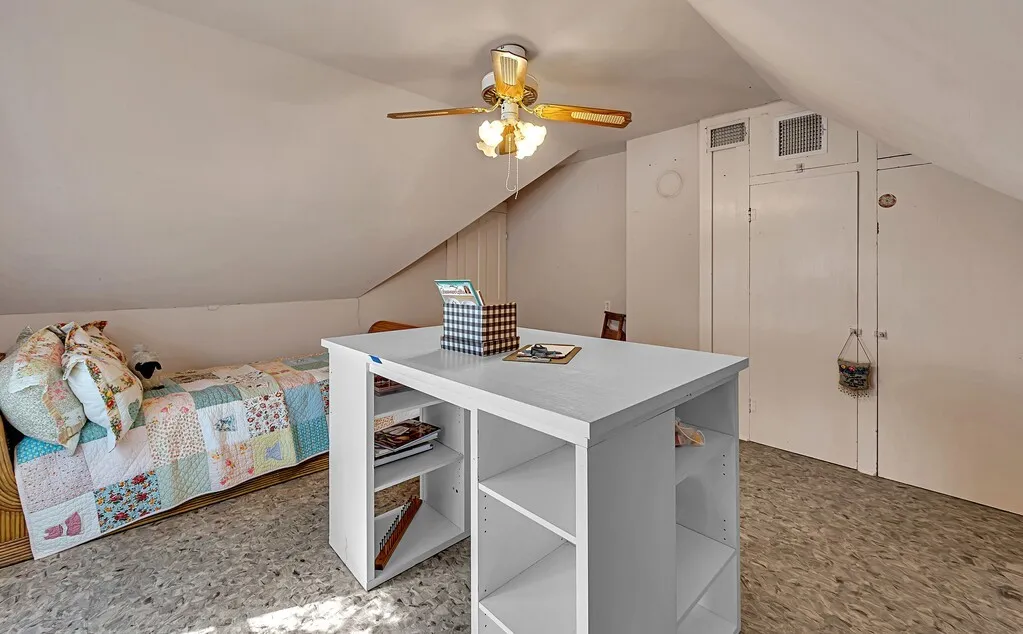 Bedroom with lofted ceiling and ceiling fan