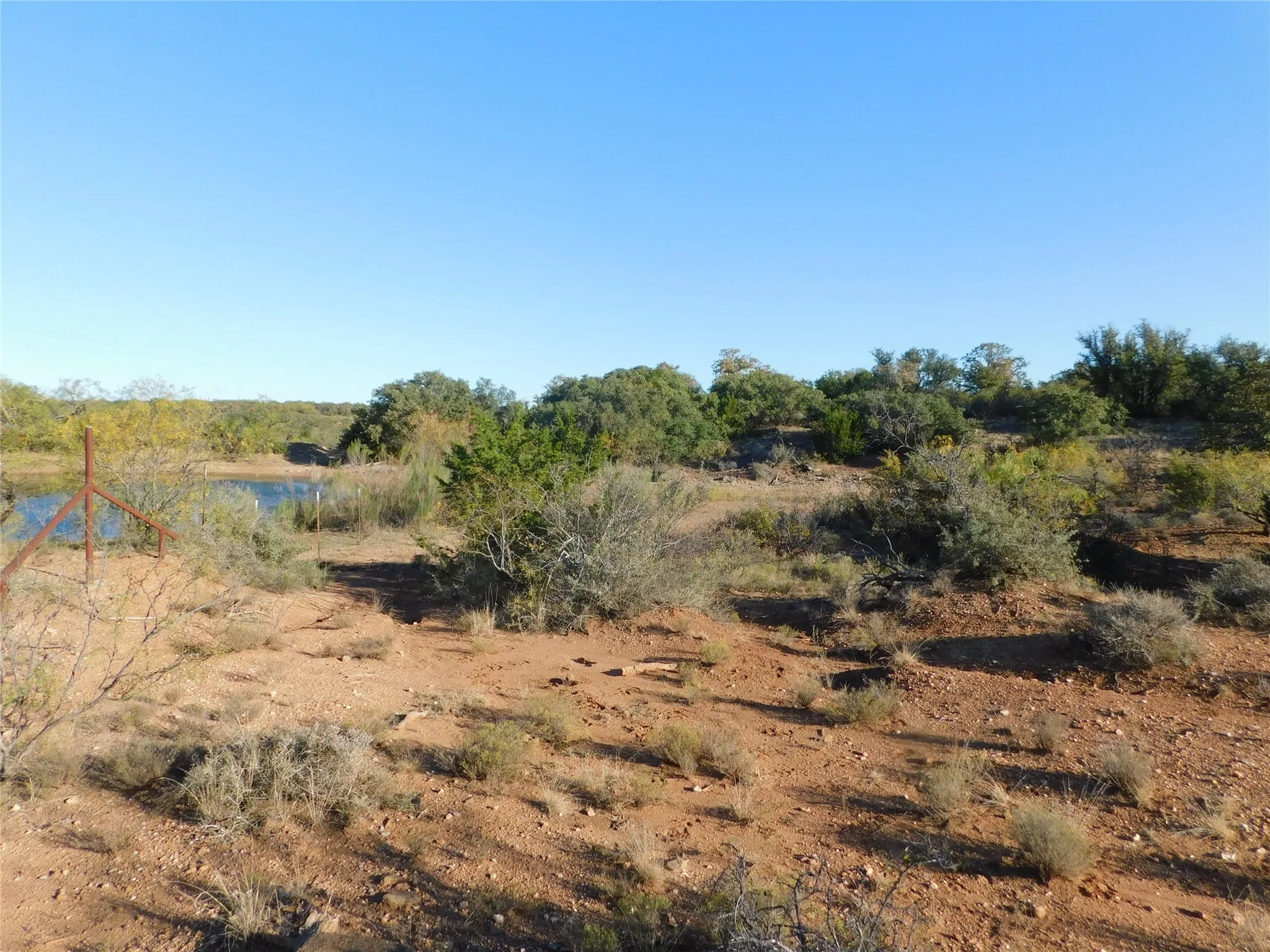 View of undeveloped land with a nearby body of water