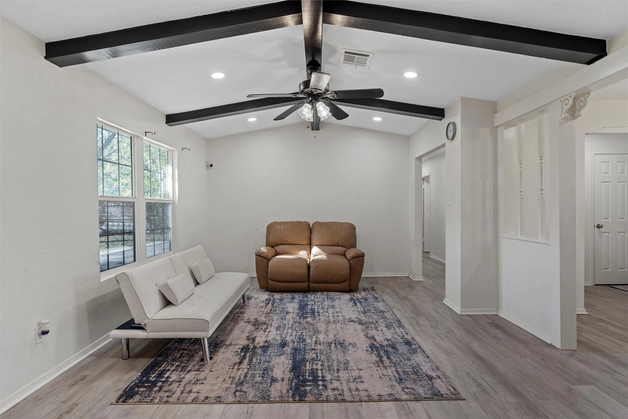 Sitting room with light wood-style floors, ceiling fan, and recessed lighting