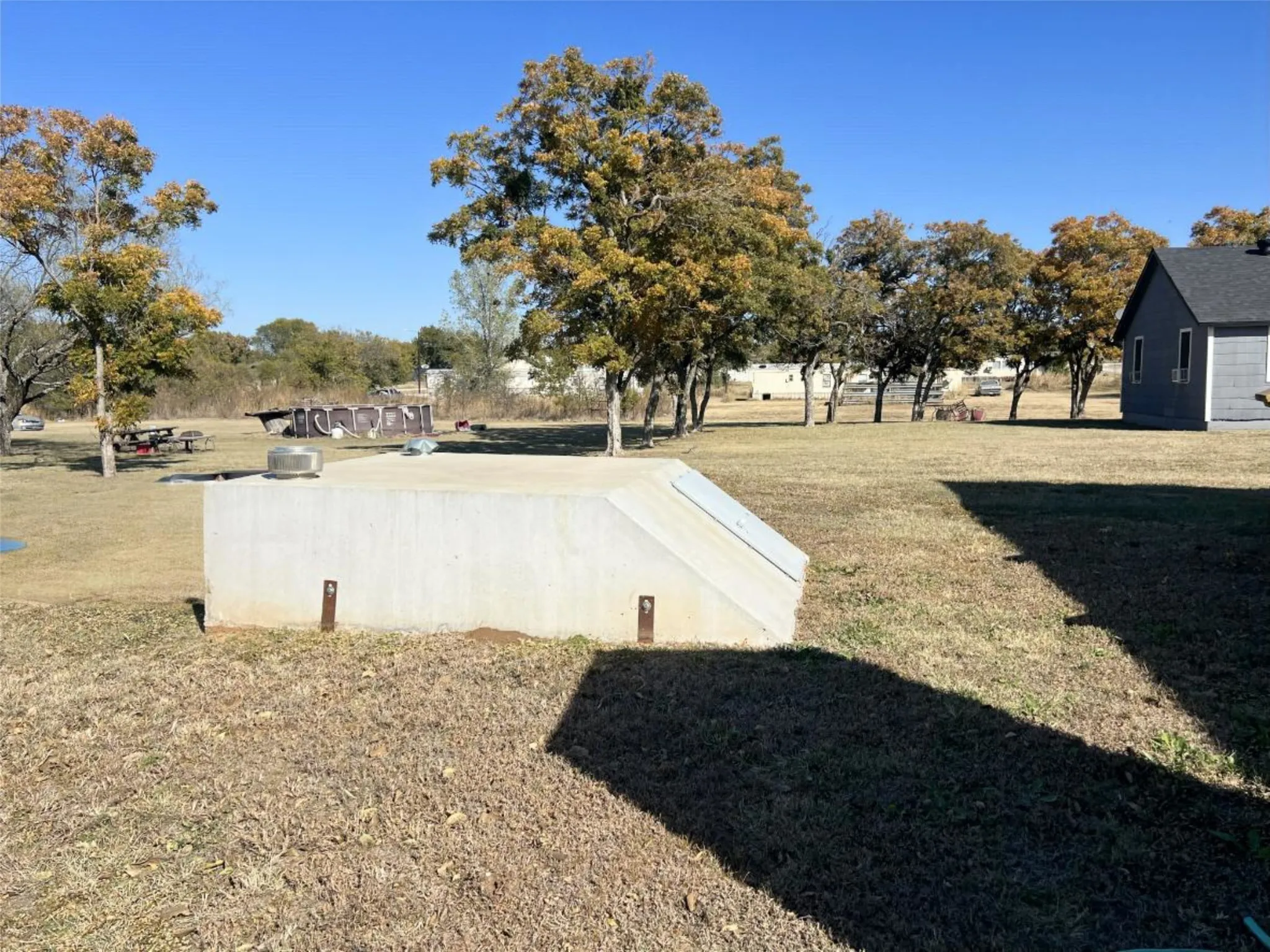 Entry to storm shelter with a lawn