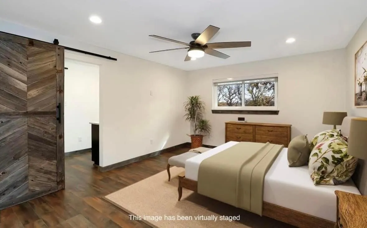 Bedroom featuring recessed lighting, dark wood-style flooring, a barn door, and a ceiling fan