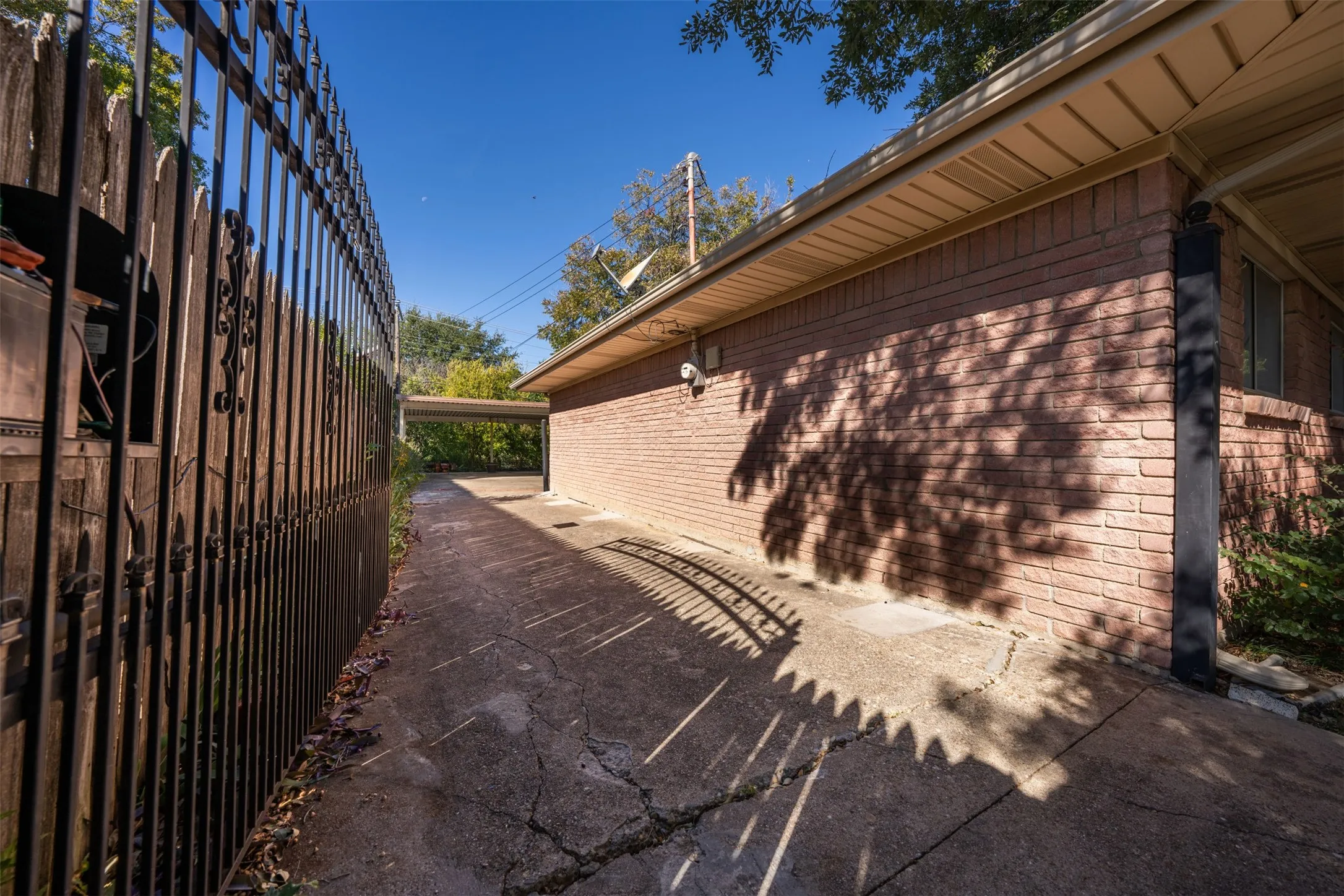View of property exterior with brick siding