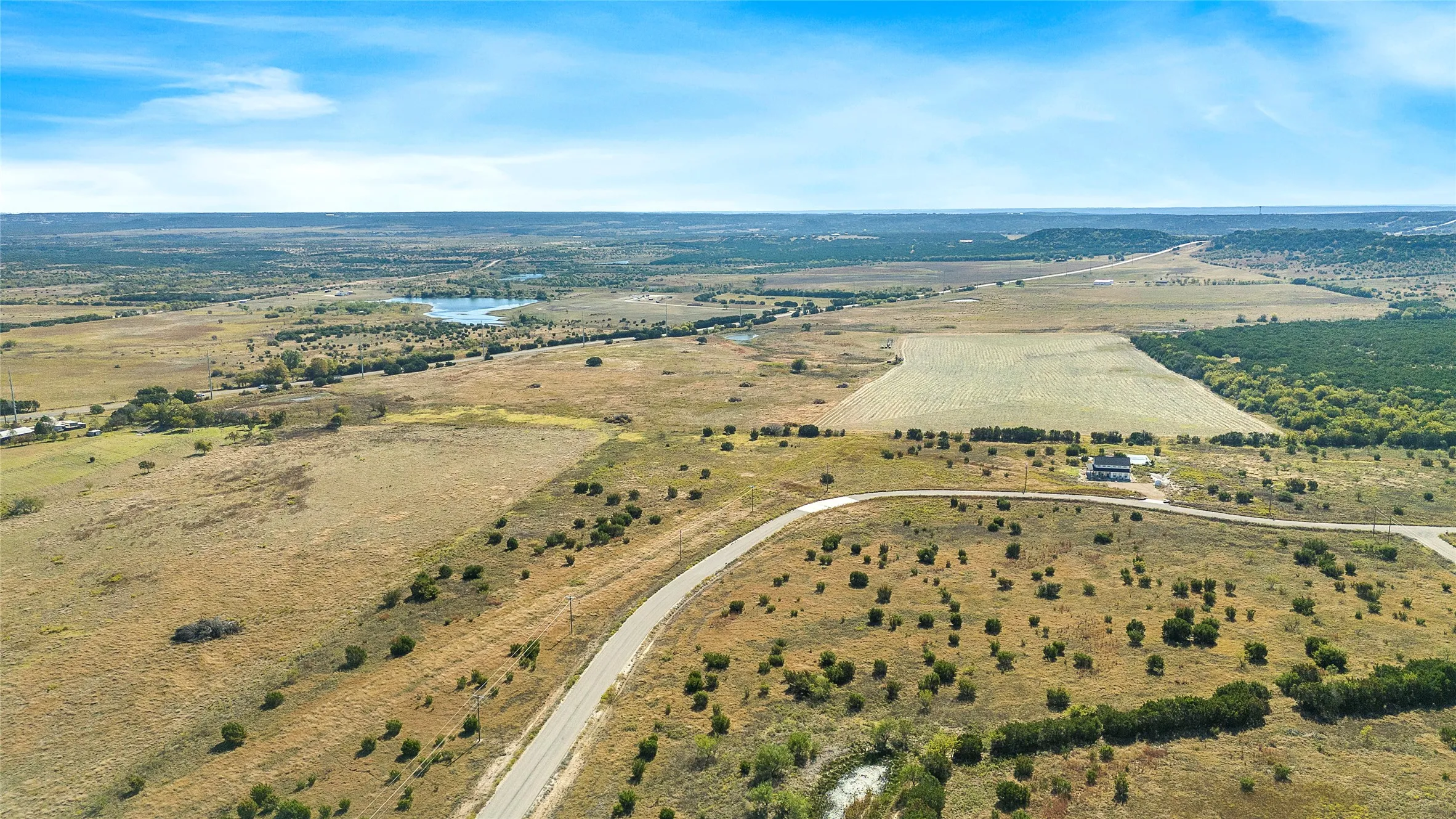Overview of rural landscape with a nearby body of water