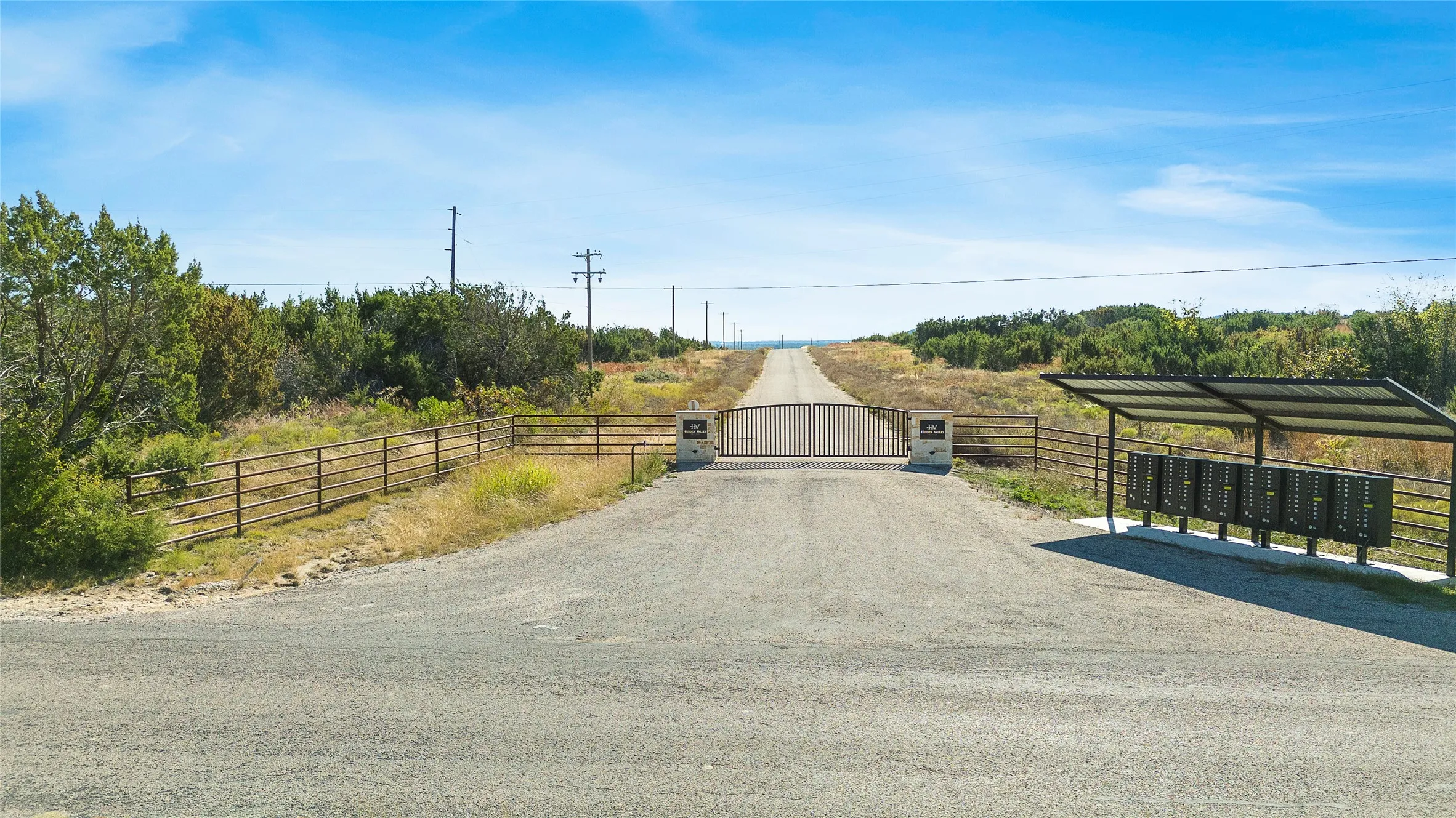 View of street featuring a gate and a gated entry