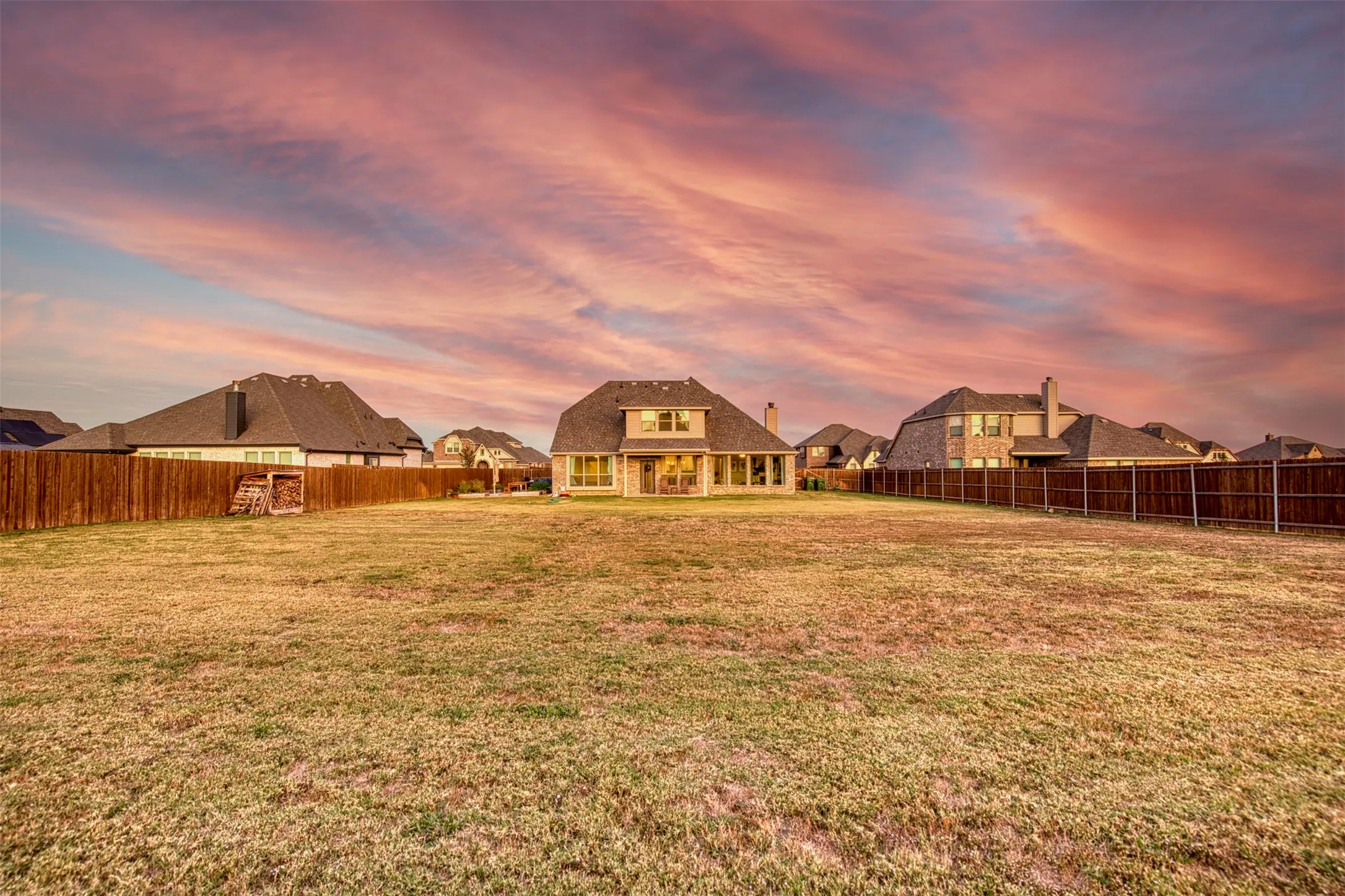 Impressive backyard surrounded by wood privacy fence.