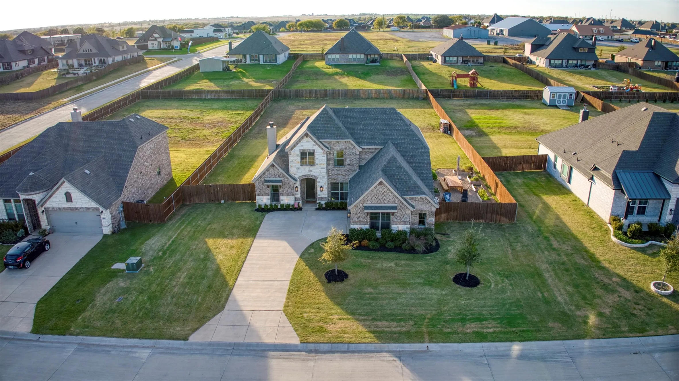 Aerial view of front of home showcasing lot.