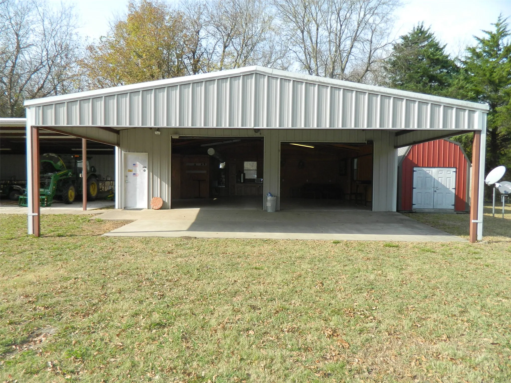 Carport and entry to the garage, kitchenette, bathroom