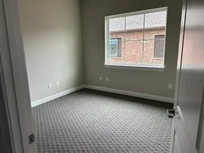Empty room featuring carpet