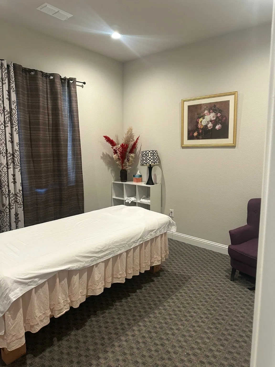 Bedroom featuring baseboards and dark carpet