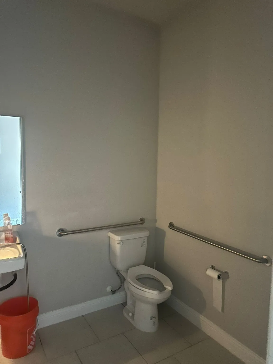 Bathroom with light tile patterned flooring