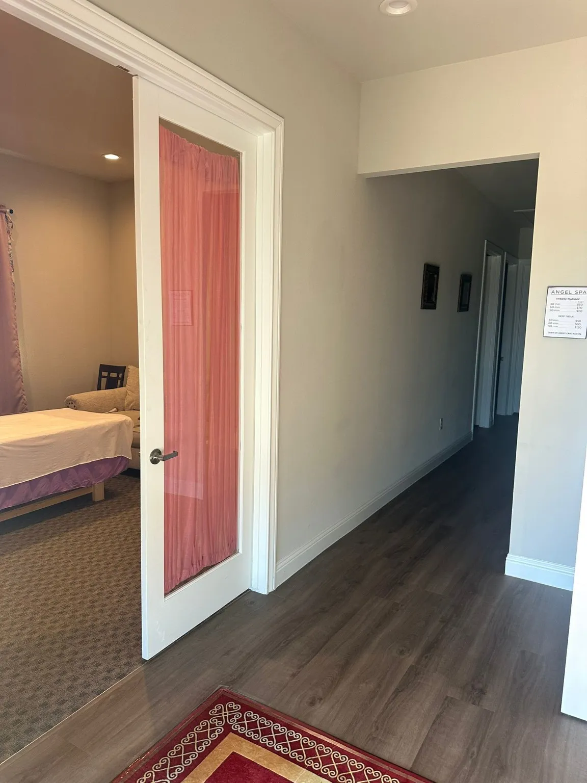 Hallway with recessed lighting and dark wood finished floors