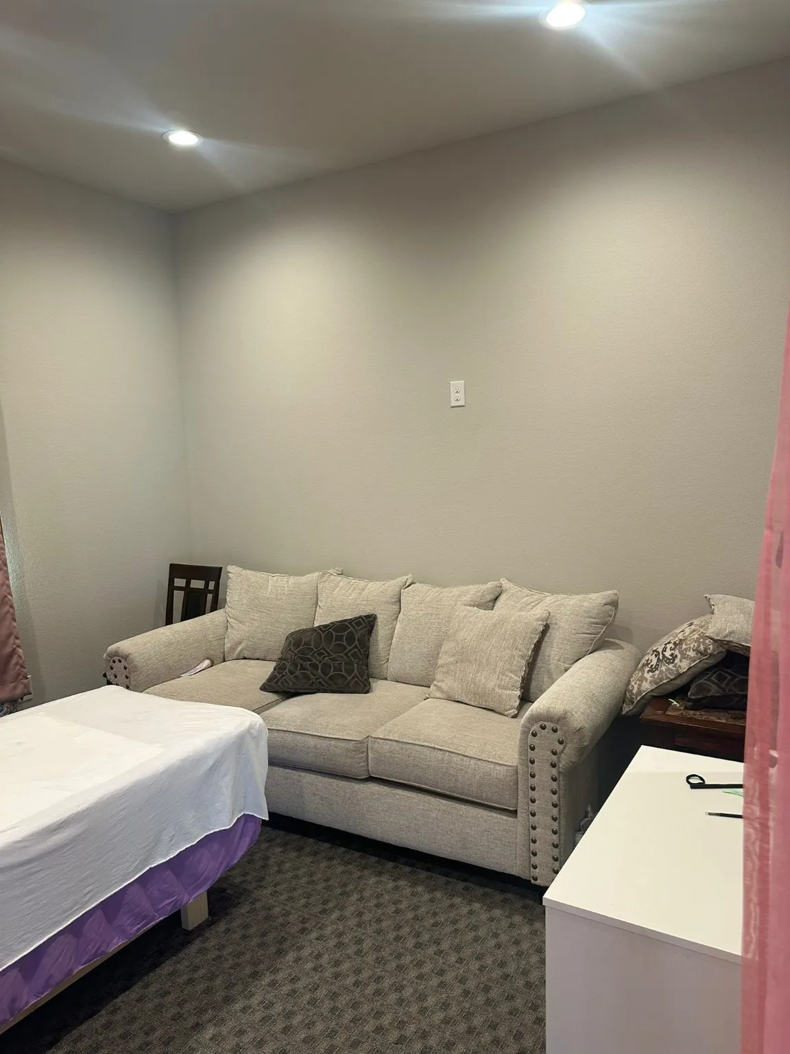 Bedroom with recessed lighting and dark colored carpet