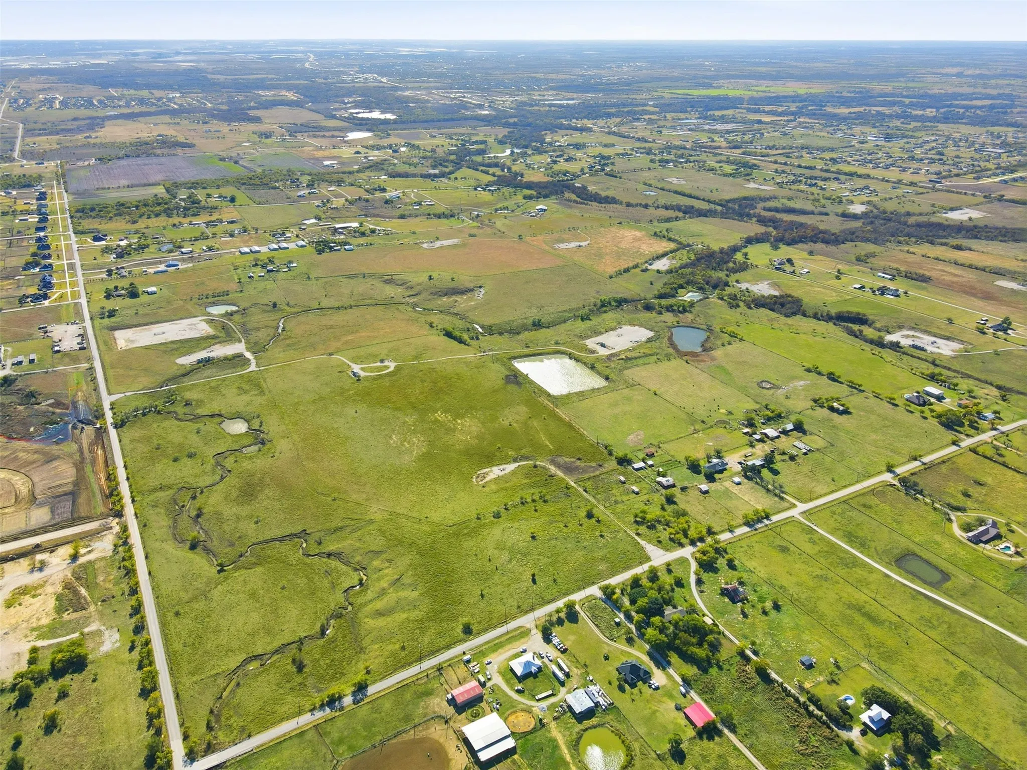 PROPERTY VIEW FROM THE NORTHEAST LOOKING SOUTHWEST