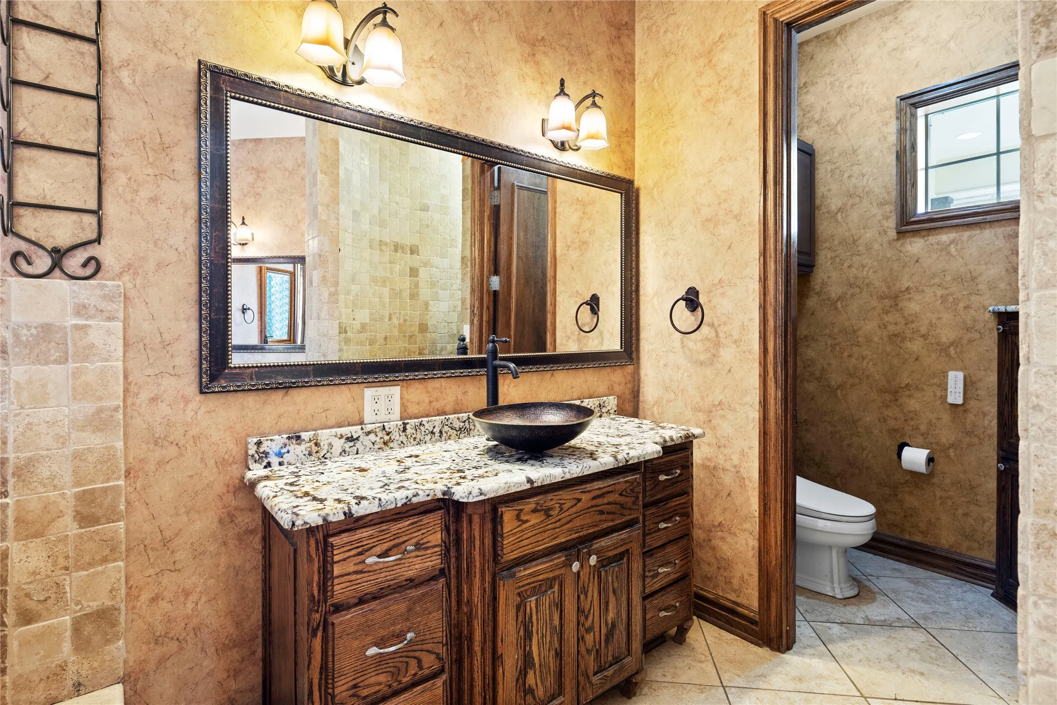 Full bathroom with vanity and light tile patterned flooring