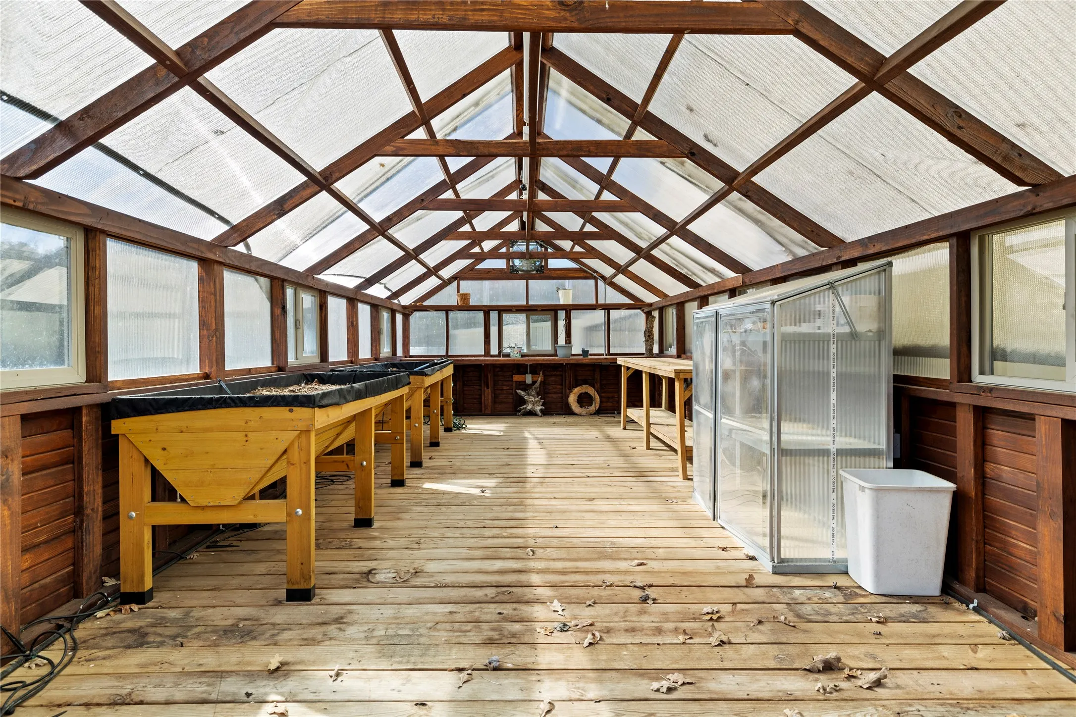 Unfurnished sunroom with lofted ceiling
