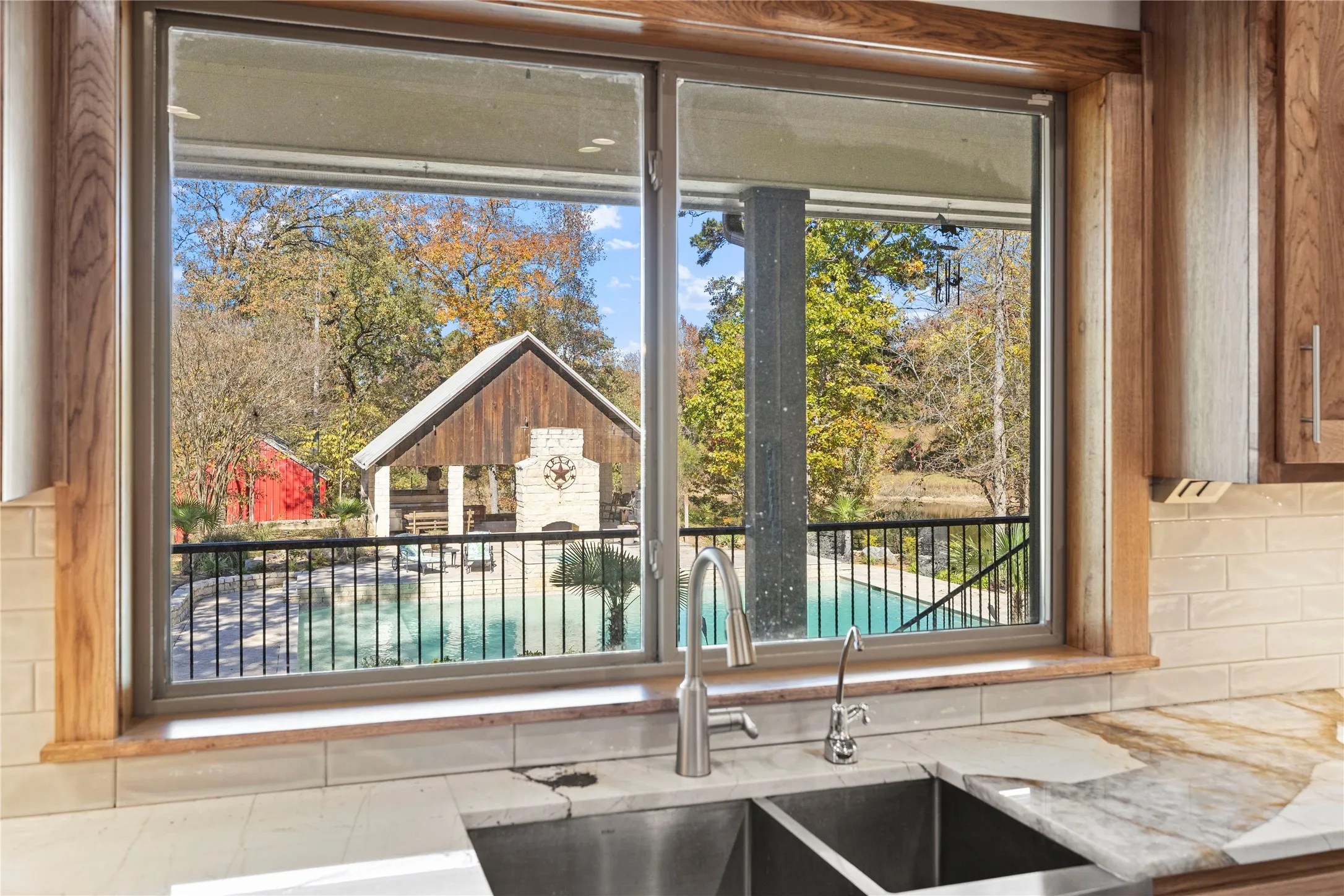 Kitchen view of light stone countertops and backsplash