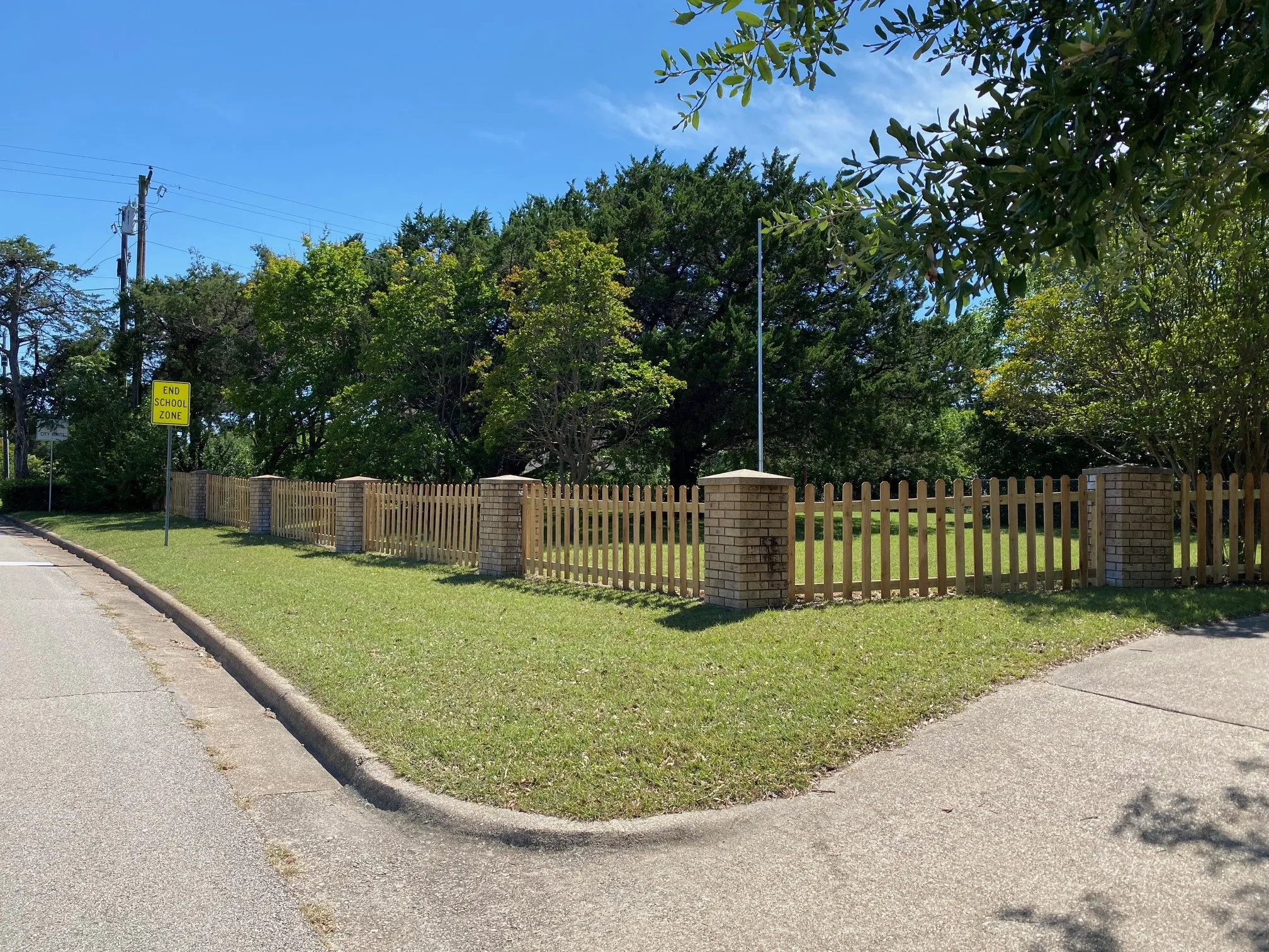 New wooden picket fence along Softwood drive