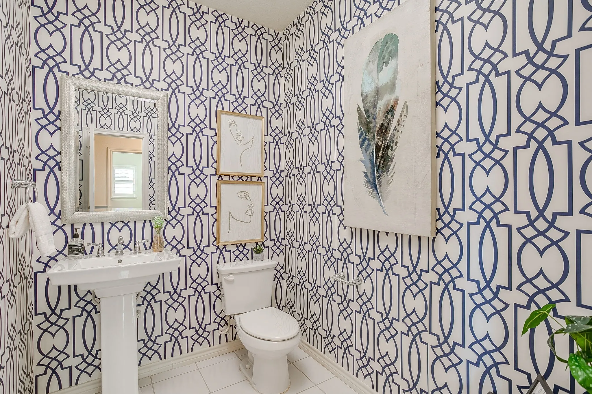 Half bathroom with tile patterned floors and toilet