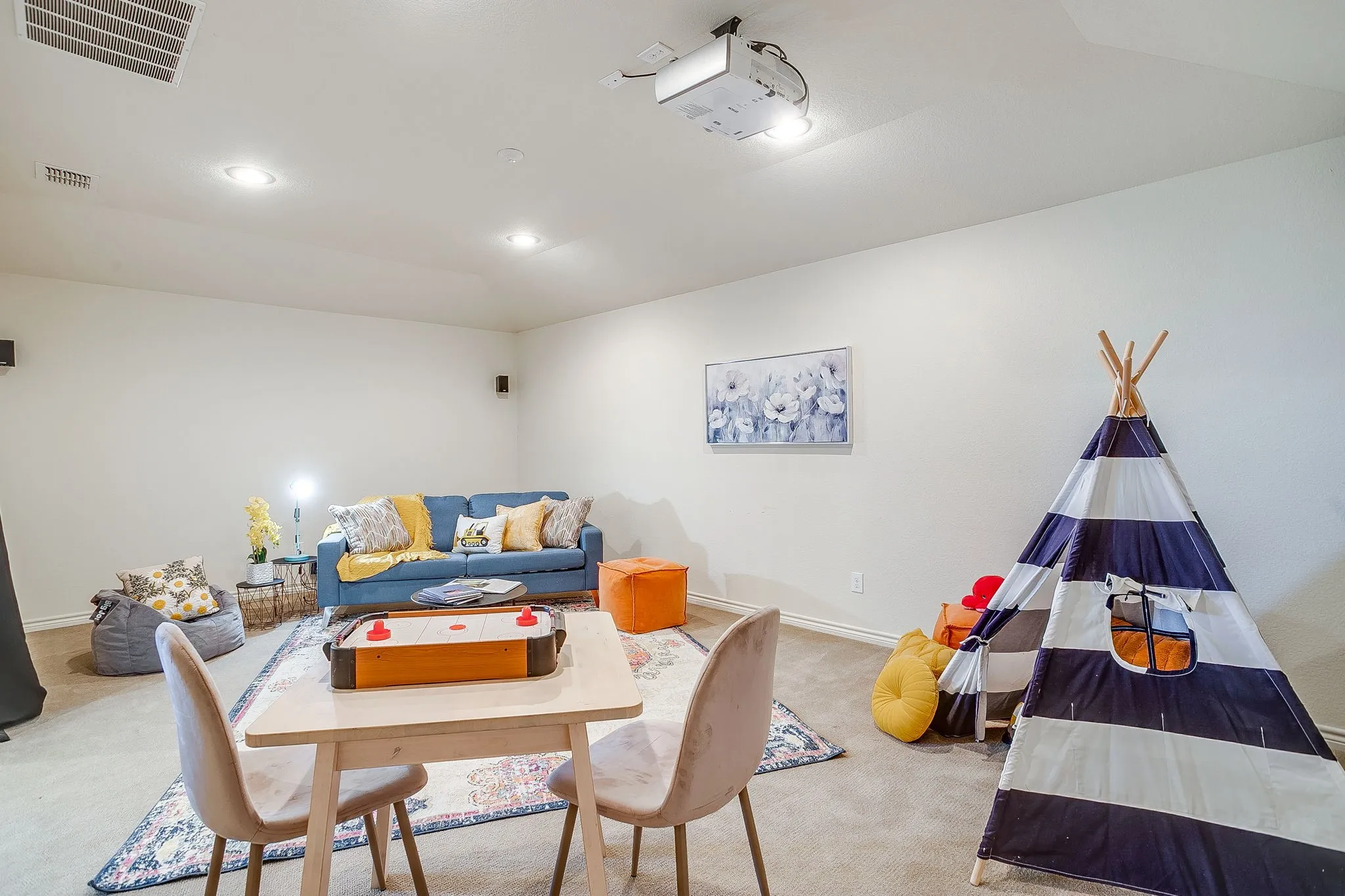 Playroom featuring carpet flooring, recessed lighting, and vaulted ceiling