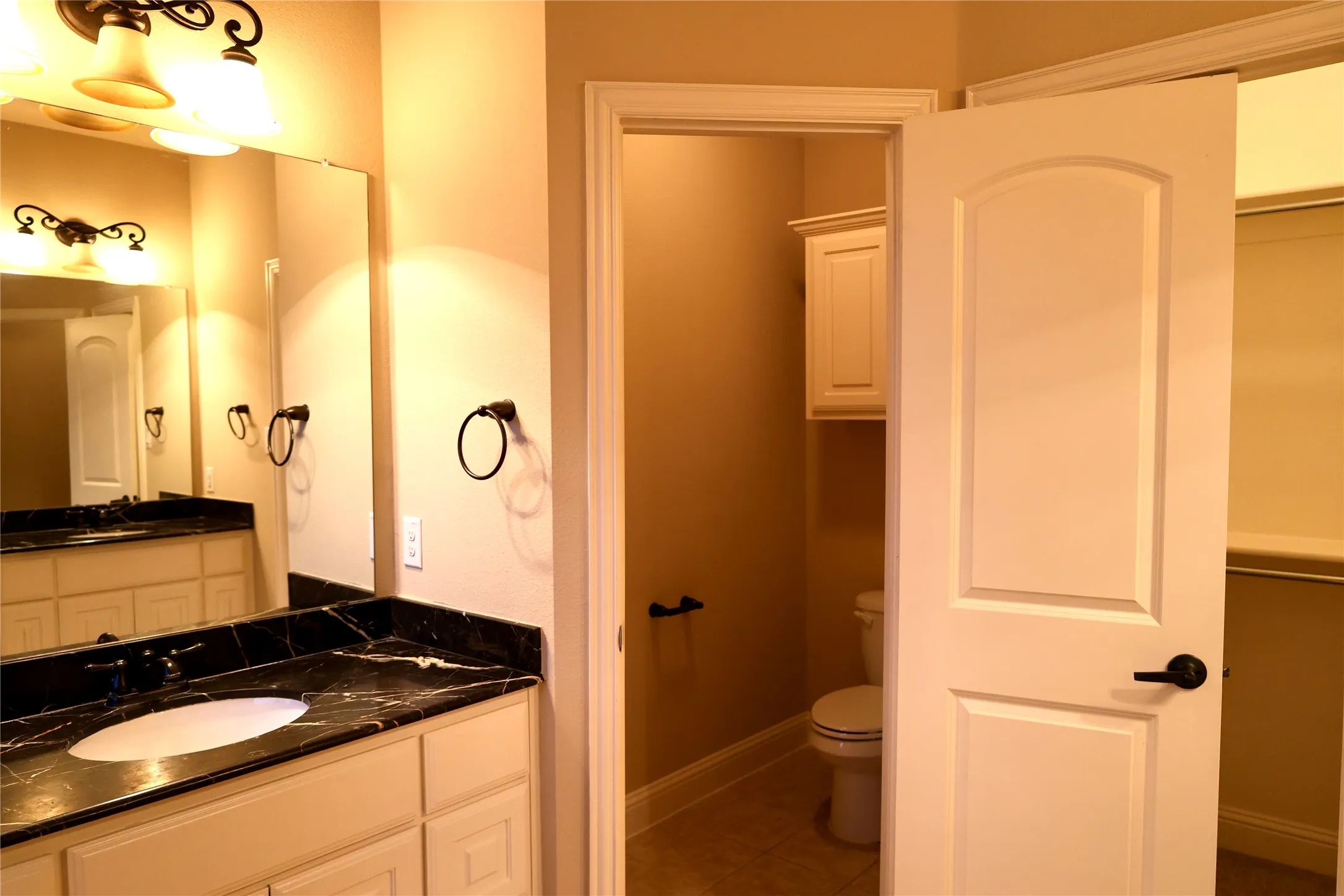 Bathroom featuring vanity and light tile patterned floors