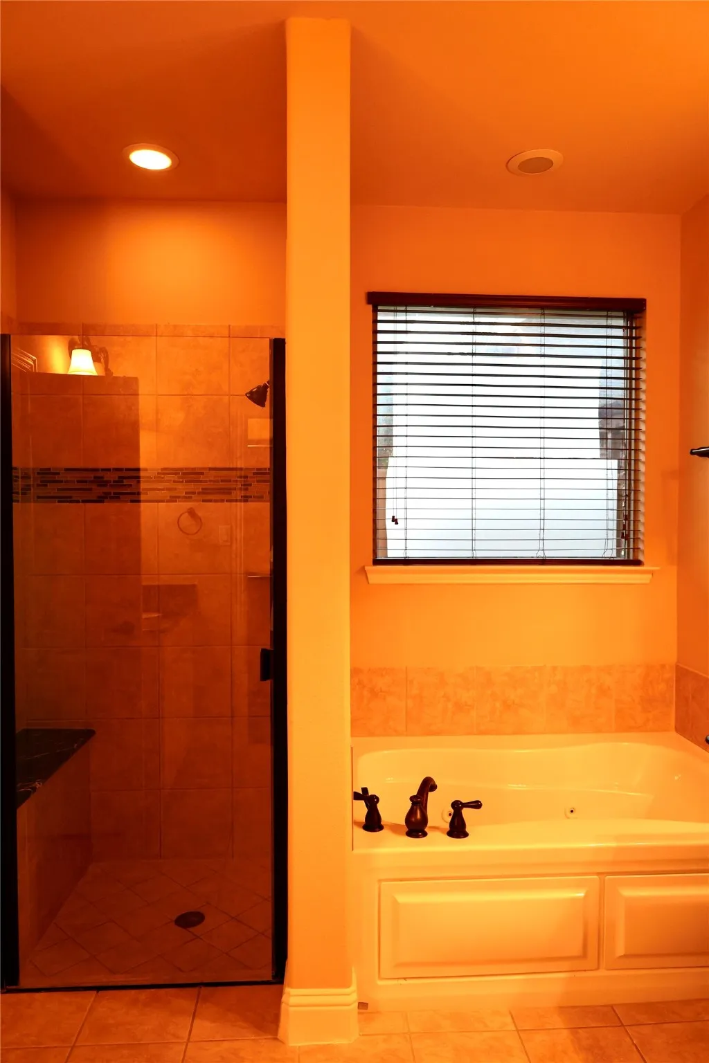 Full bath featuring light tile patterned floors, a garden tub, a stall shower, and recessed lighting
