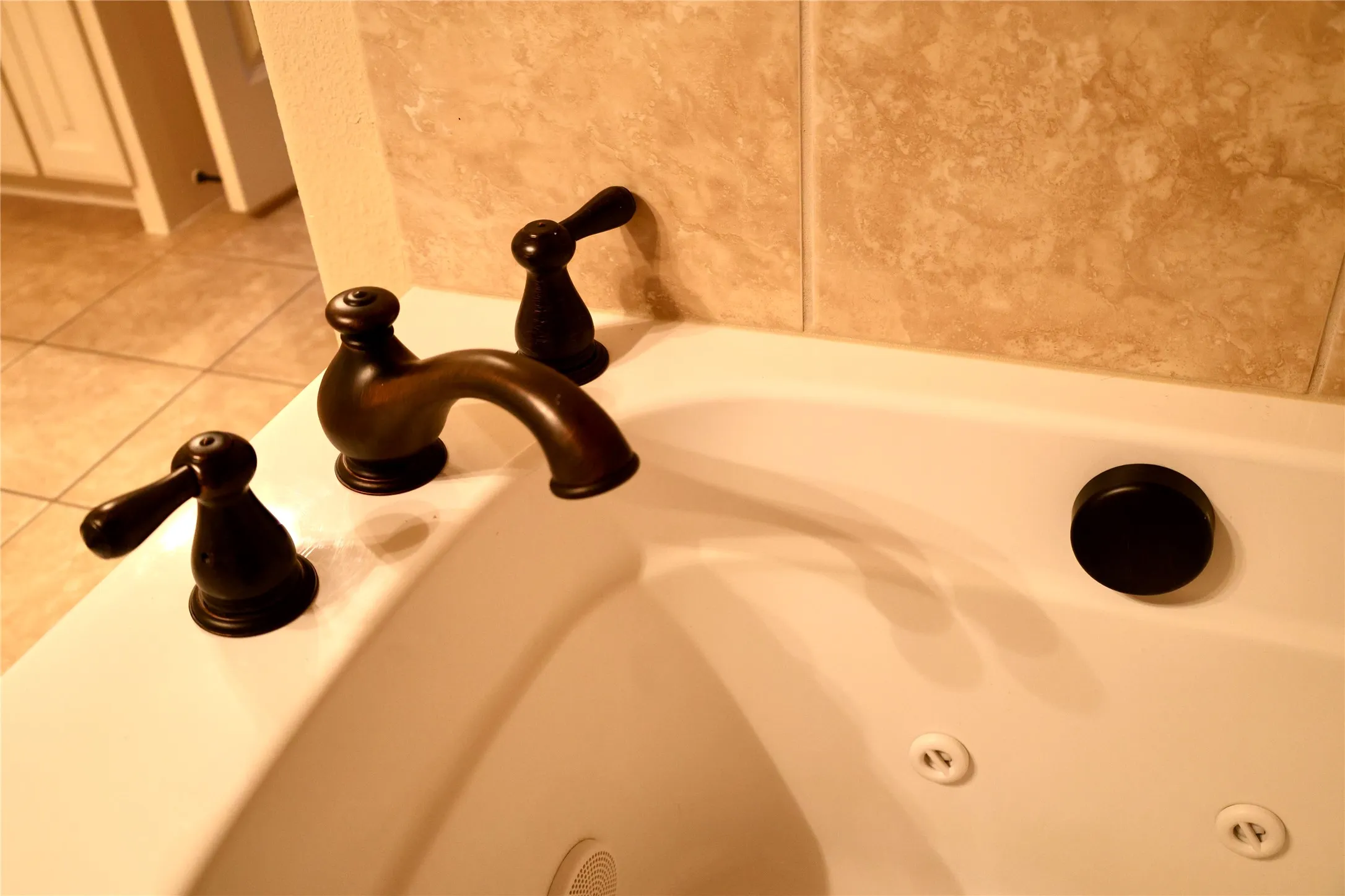 Bathroom view of a sink and a bath